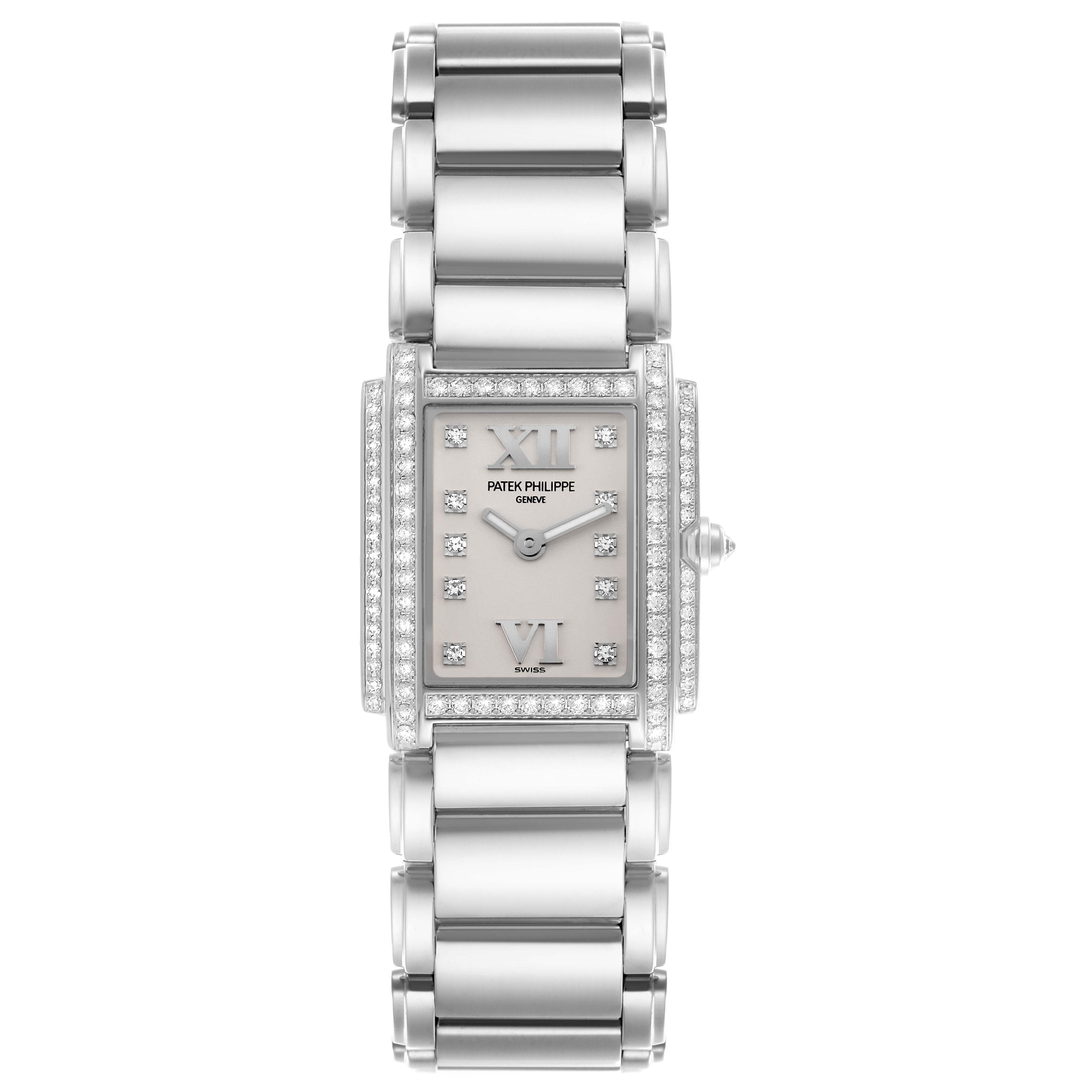 The Patek Philippe Twenty-4 4908/200G-011 Women's White Gold Silver Dial 4908/200G-011 Women's White Gold Silver Dial watch is shown from a top-down angle, displaying its face, bezel, and bracelet.