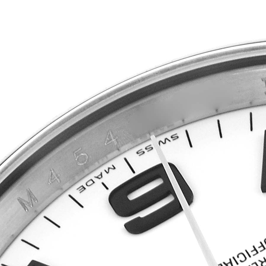 The image shows a close-up of the Rolex Air-King 114200 Men's Stainless Steel White Dial 114200 Men's Stainless Steel White Dial watch dial, highlighting the bezel and number 9.