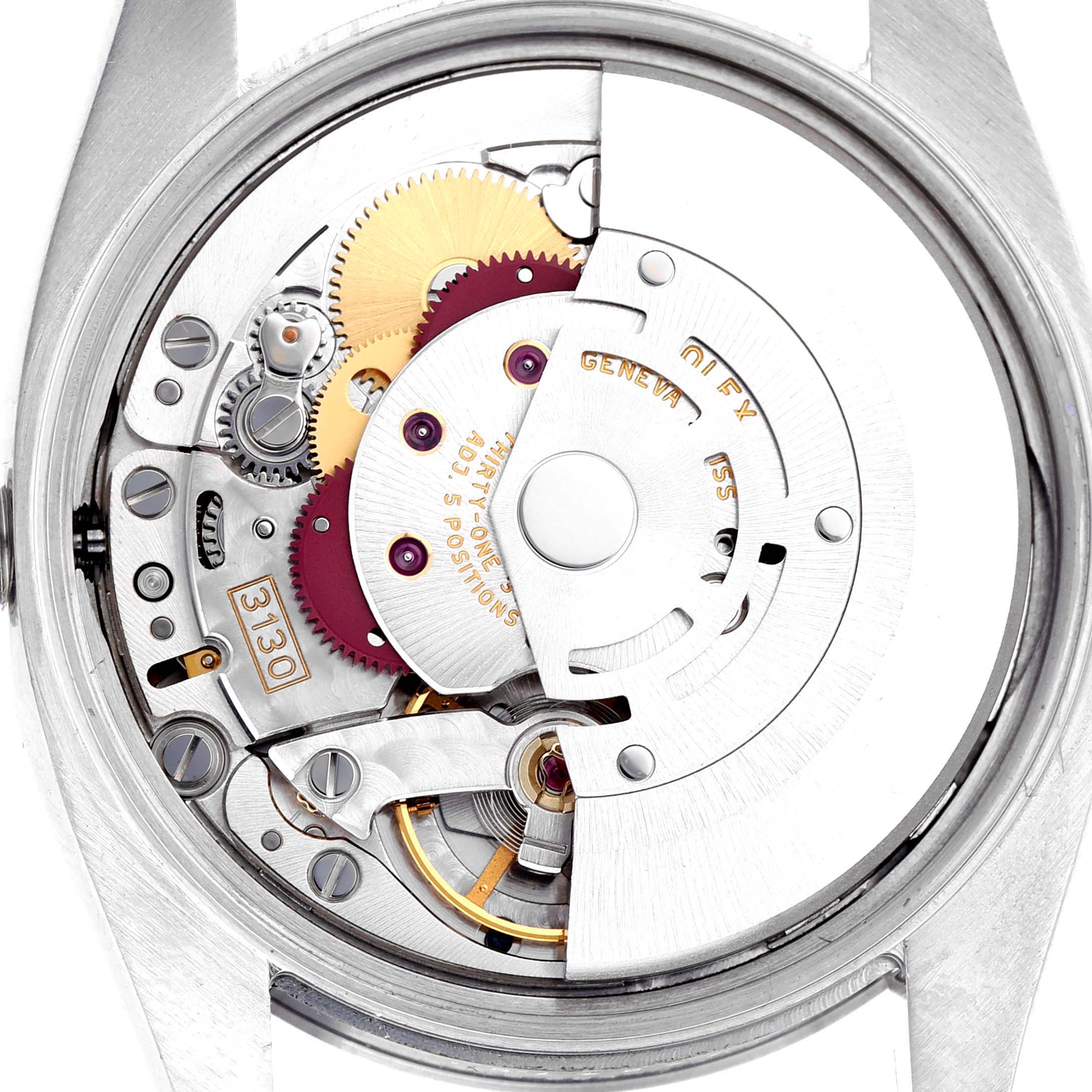 The image shows the movement of a Rolex Air-King 114200 Men's Stainless Steel White Dial 114200 Men's Stainless Steel White Dial watch viewed from the back, highlighting gears and mechanical parts.