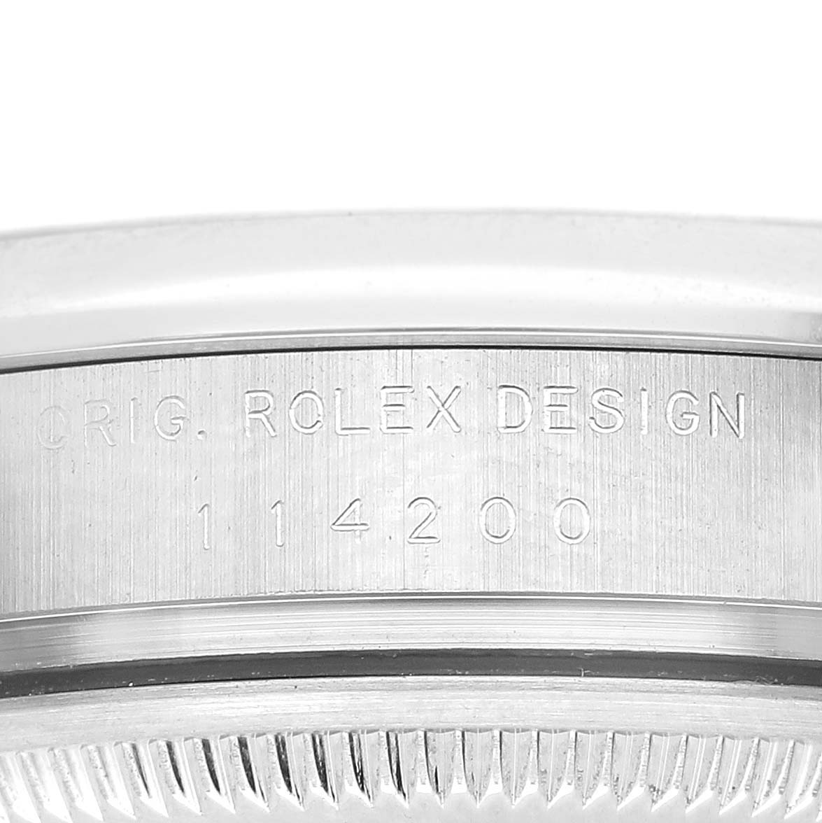 The image shows a close-up of the case side of a Rolex Air-King 114200 Men's Stainless Steel White Dial 114200 Men's Stainless Steel White Dial, displaying the engraved model number and design details.