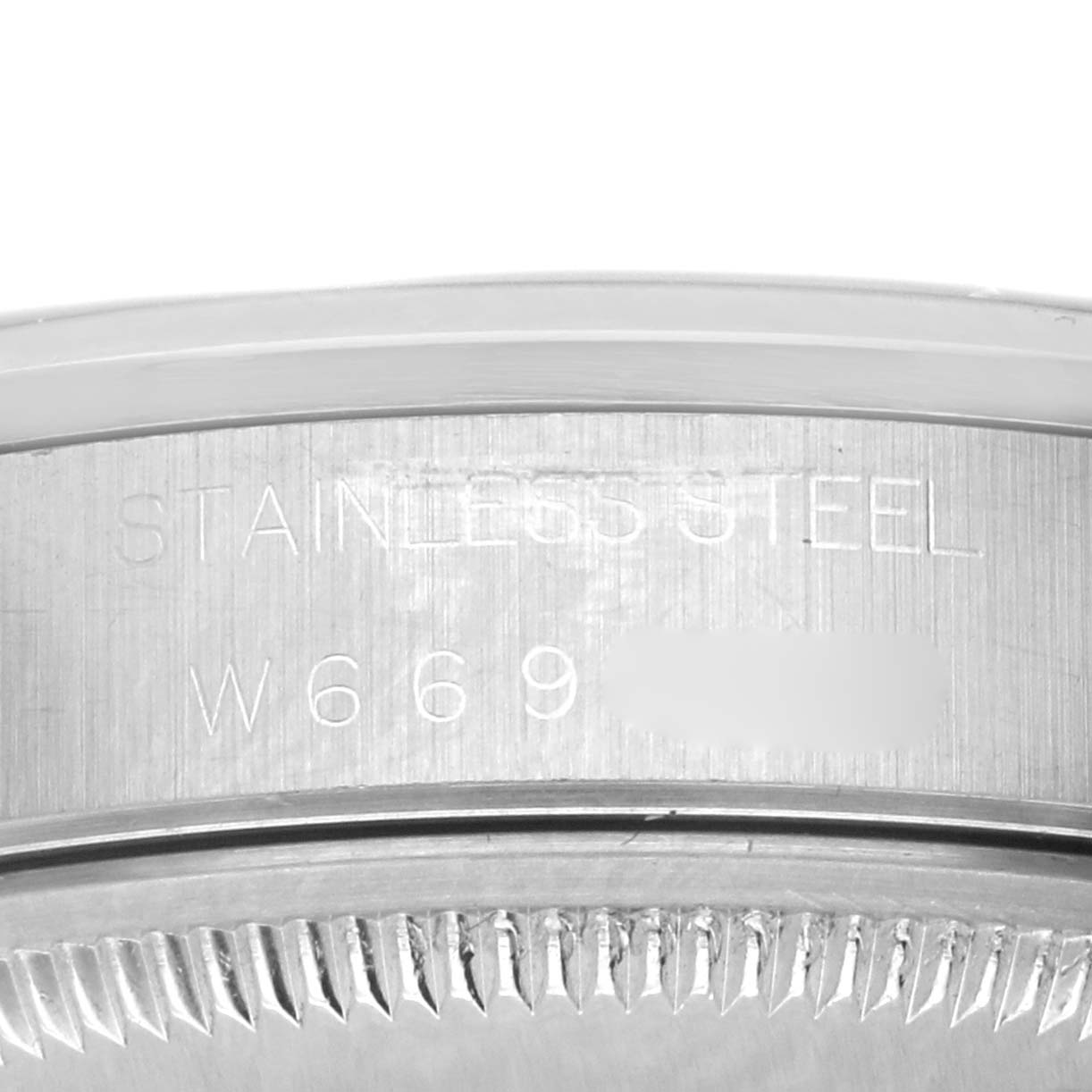 The image shows the side view of a Rolex Date 15200 Men's Stainless Steel Blue Dial 15200 Men's Stainless Steel Blue Dial model, focusing on the engraved stainless steel case.