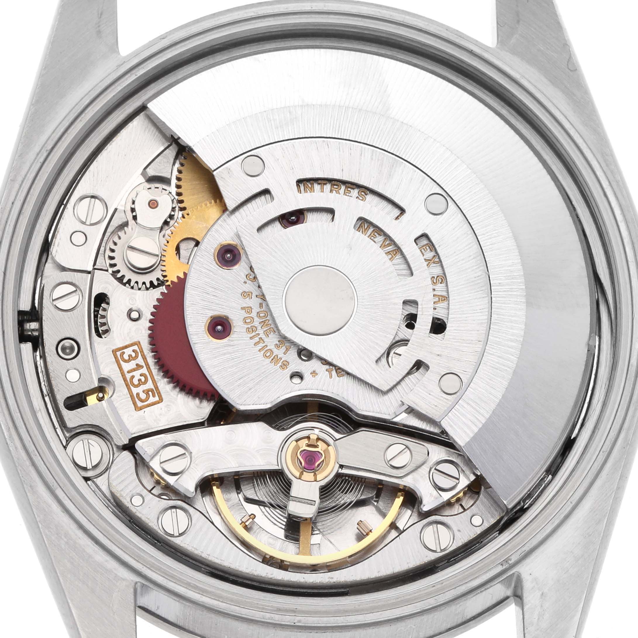 The image shows the movement mechanics of the Rolex Date 15200 Men's Stainless Steel Blue Dial 15200 Men's Stainless Steel Blue Dial model from a top-down angle, revealing gears and the rotor.