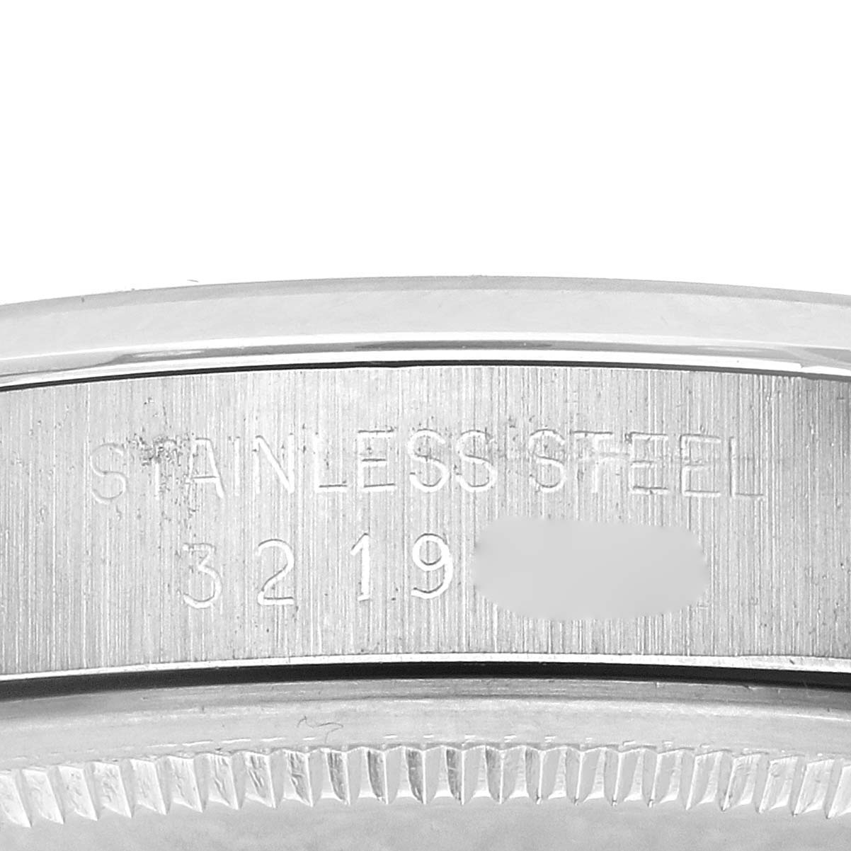 The image shows a close-up side view of the stainless steel case with engravings of a Rolex Date 1500 Men's Stainless Steel Silver Dial 1500 Men's Stainless Steel Silver Dial model.
