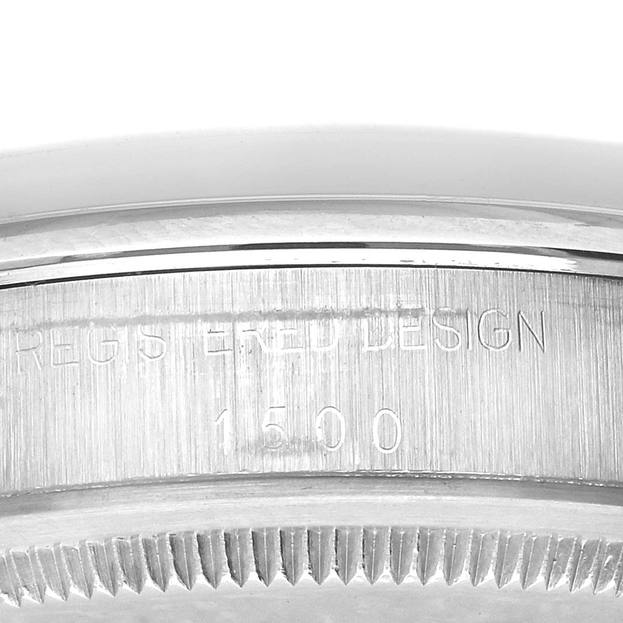 The image shows a close-up of the bezel and case side of the Rolex Date 1500 Men's Stainless Steel Black Dial 1500 Men's Stainless Steel Black Dial, with engraved model details.