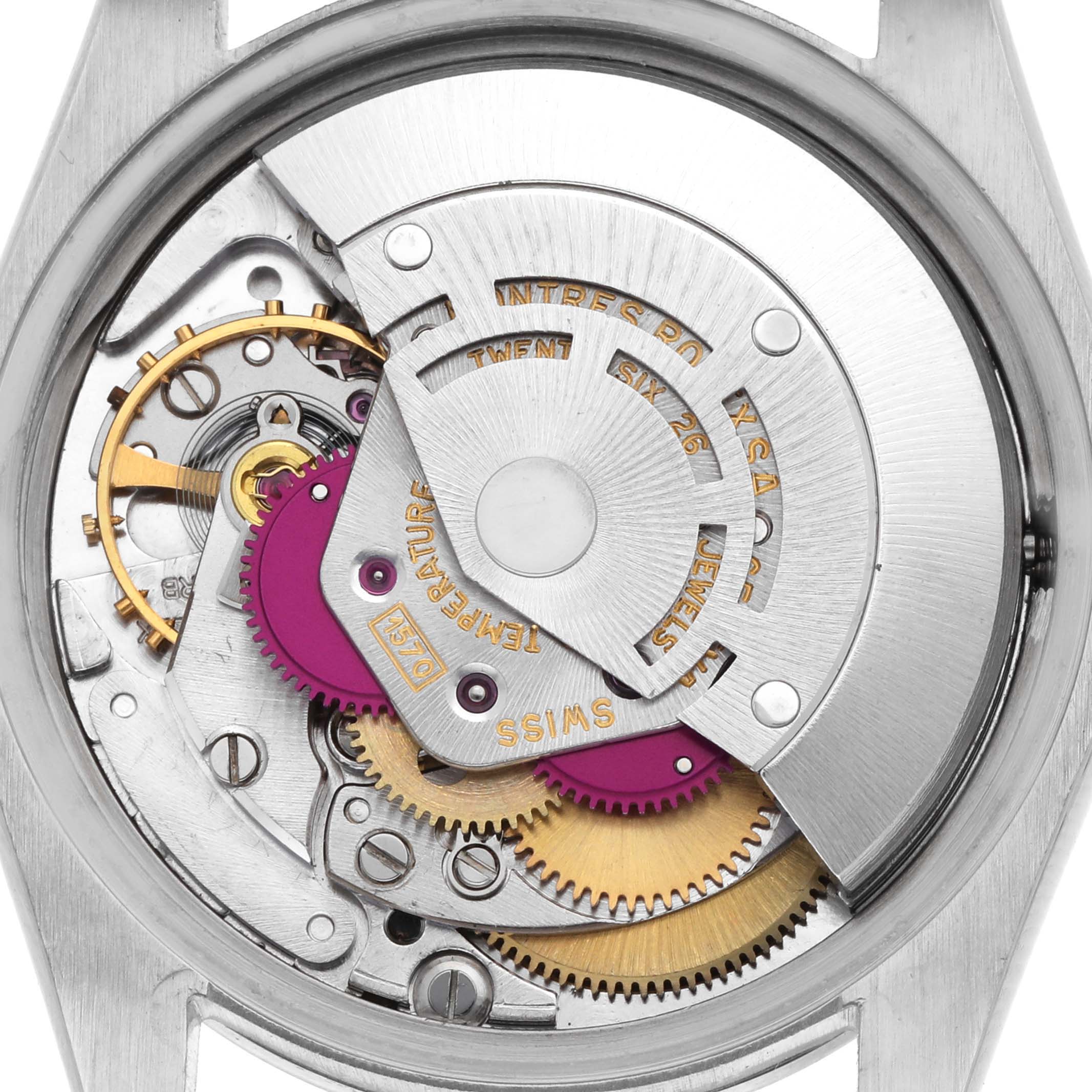 The image shows the movement of a Rolex Date 1500 Men's Stainless Steel Black Dial 1500 Men's Stainless Steel Black Dial watch, highlighting gears, jewels, and the rotor from a back view.