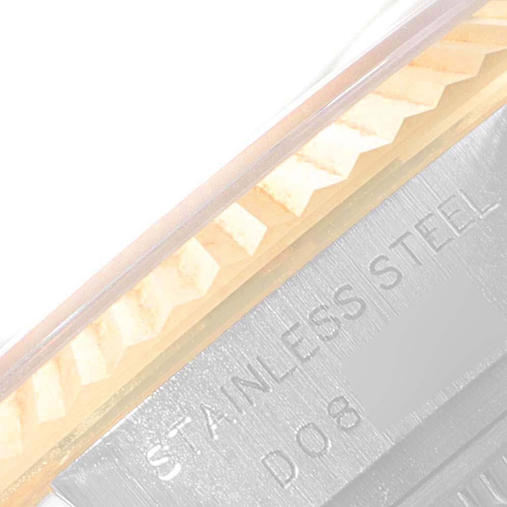 The image shows a close-up of the fluted bezel and part of the stainless steel case of a Rolex Datejust 179173 Women
s Steel and Gold (two tone) Silver Dial 179173 Women
s Steel and Gold (two tone) Silver Dial watch.