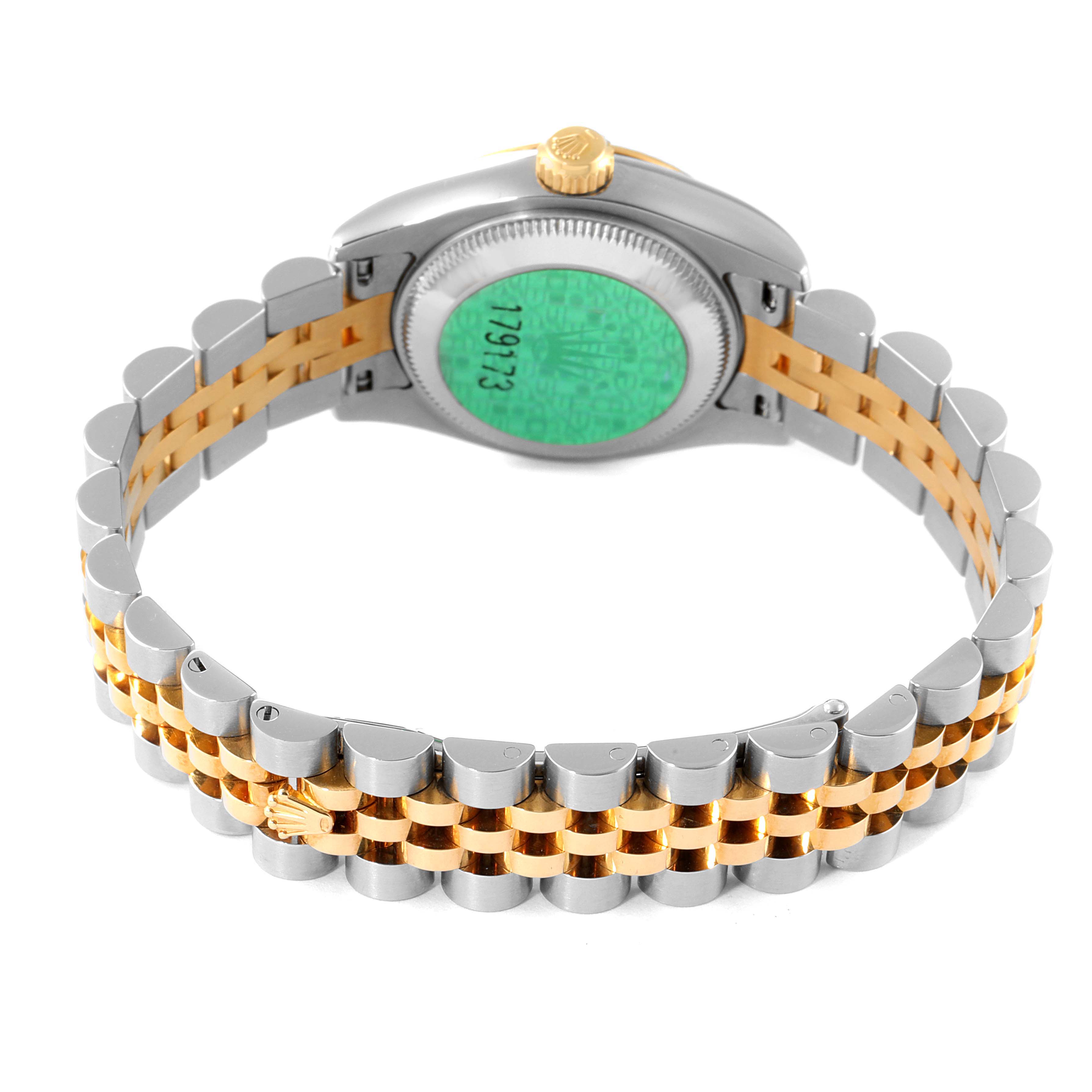 The image shows the back view of a Rolex Datejust 179173 Women
s Steel and Gold (two tone) Silver Dial 179173 Women
s Steel and Gold (two tone) Silver Dial watch, focusing on the case back and two-tone bracelet.