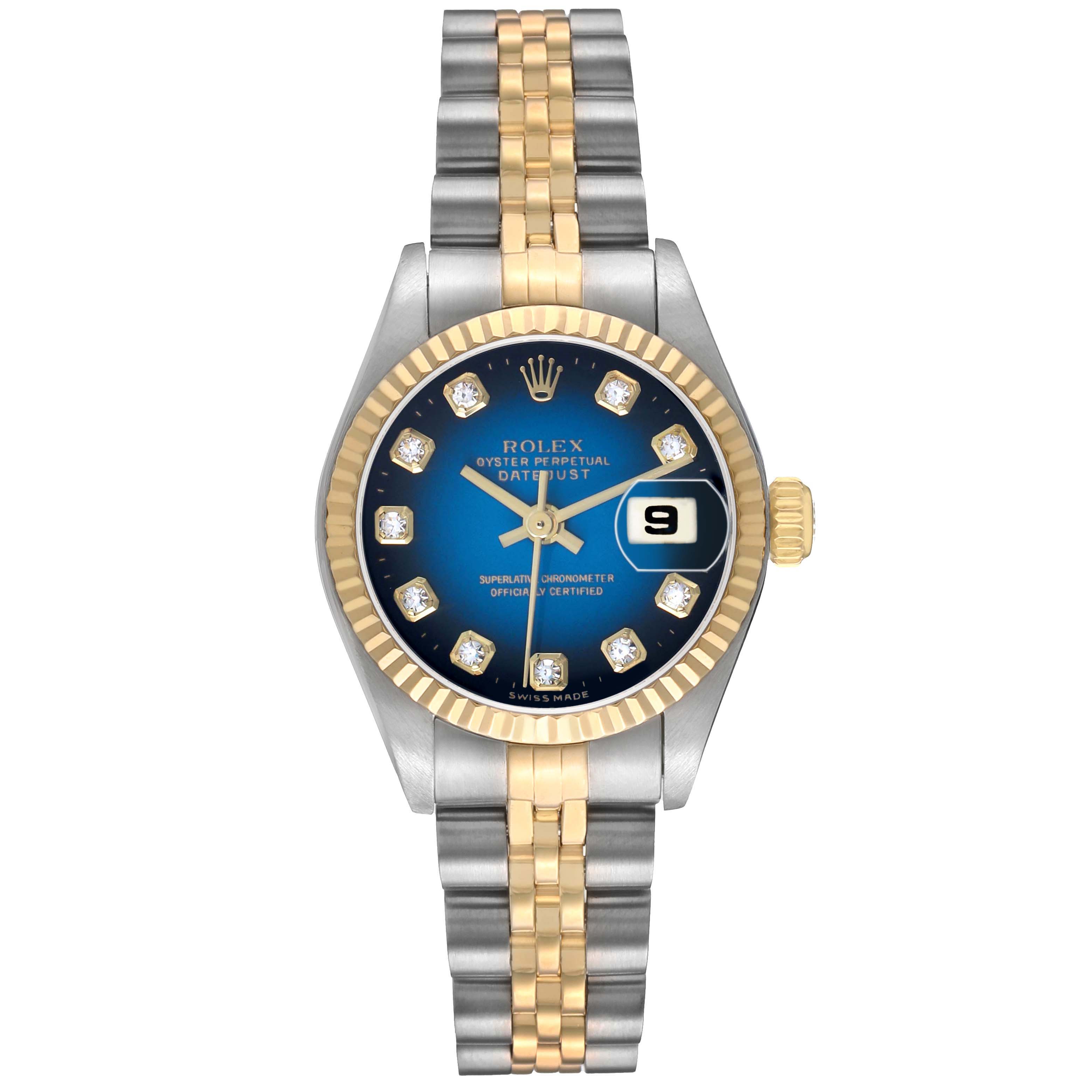 The Rolex Datejust 79173 Women's Steel and Gold (two tone) Blue Dial watch is shown from a top-down angle, displaying the blue dial, fluted bezel, and two-tone bracelet.