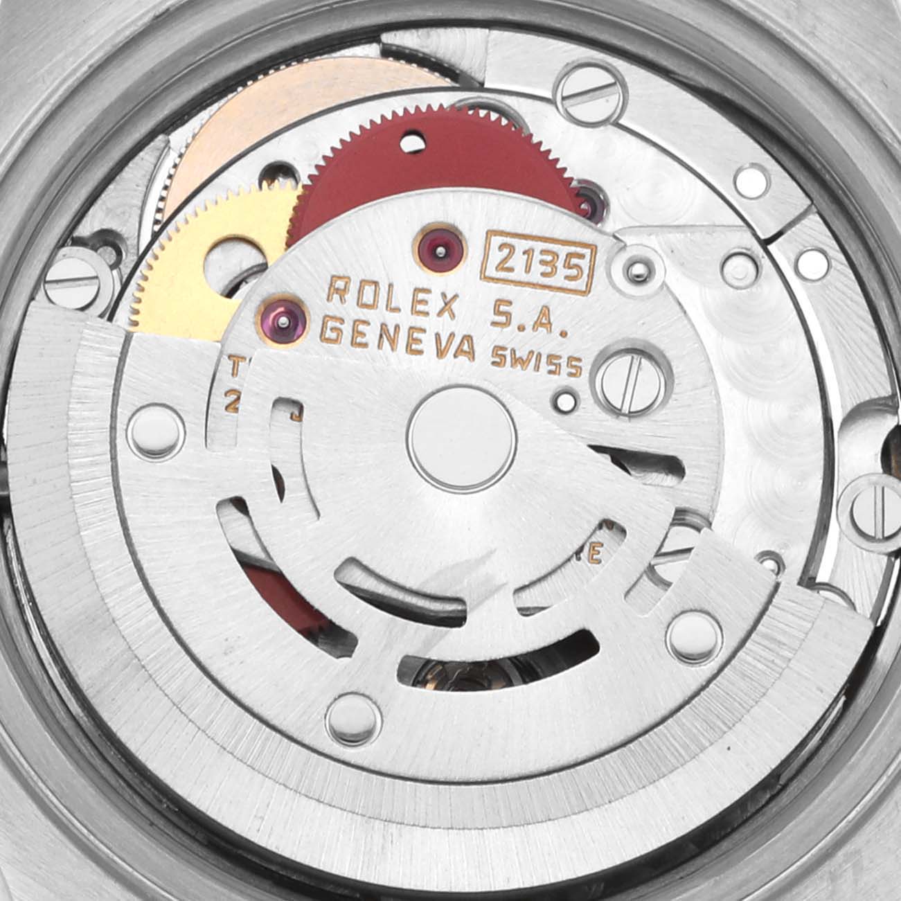 The image shows a close-up of the Rolex Datejust 69173 Women's Steel and Gold (two tone) White Dial 69173 Women's Steel and Gold (two tone) White Dial's movement with visible gears and engravings.