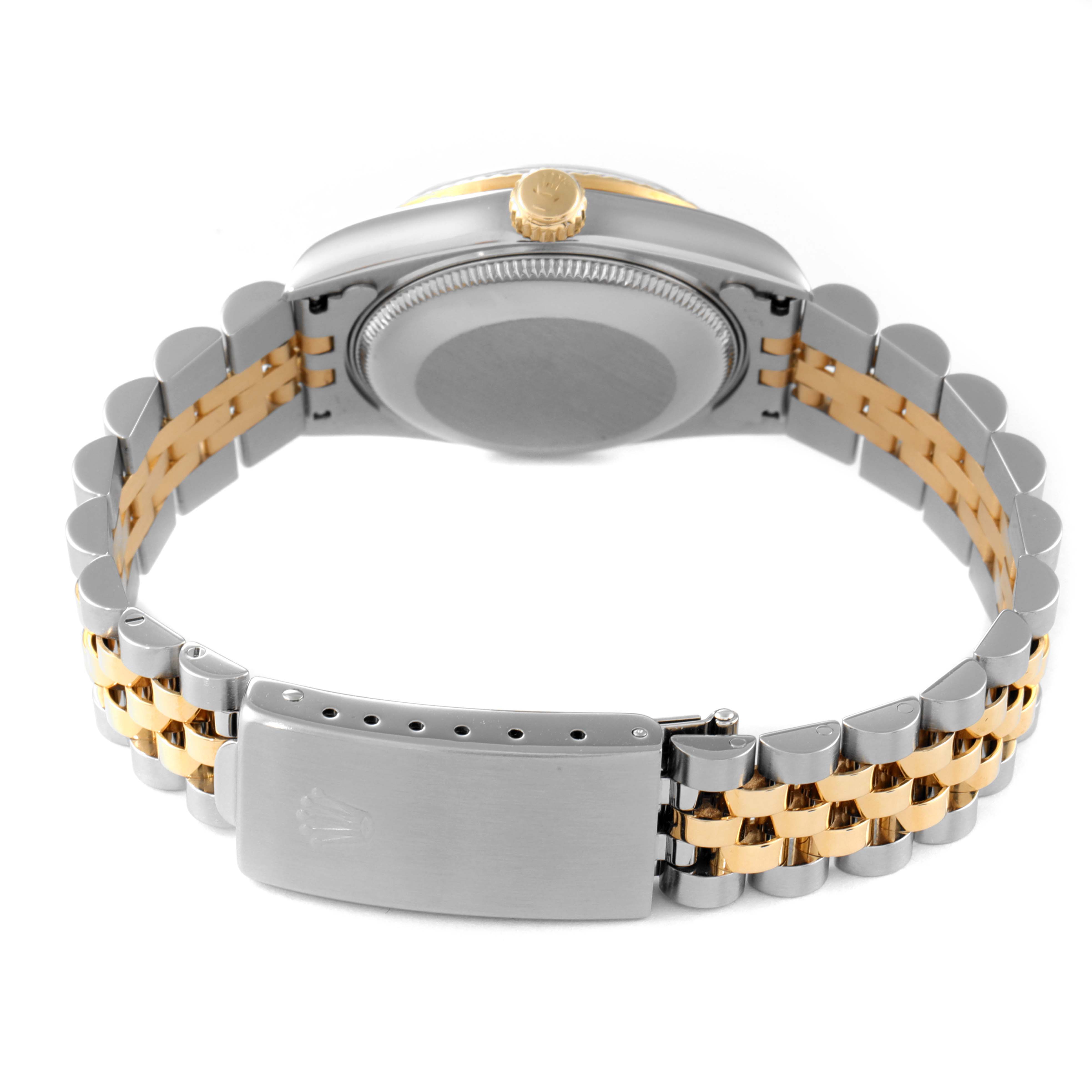 The image shows the backside and bracelet of the Rolex Mid-Size 68273 Women
s Steel and Gold (two tone) Black Dial 68273 Women
s Steel and Gold (two tone) Black Dial model, highlighting the clasp and caseback.