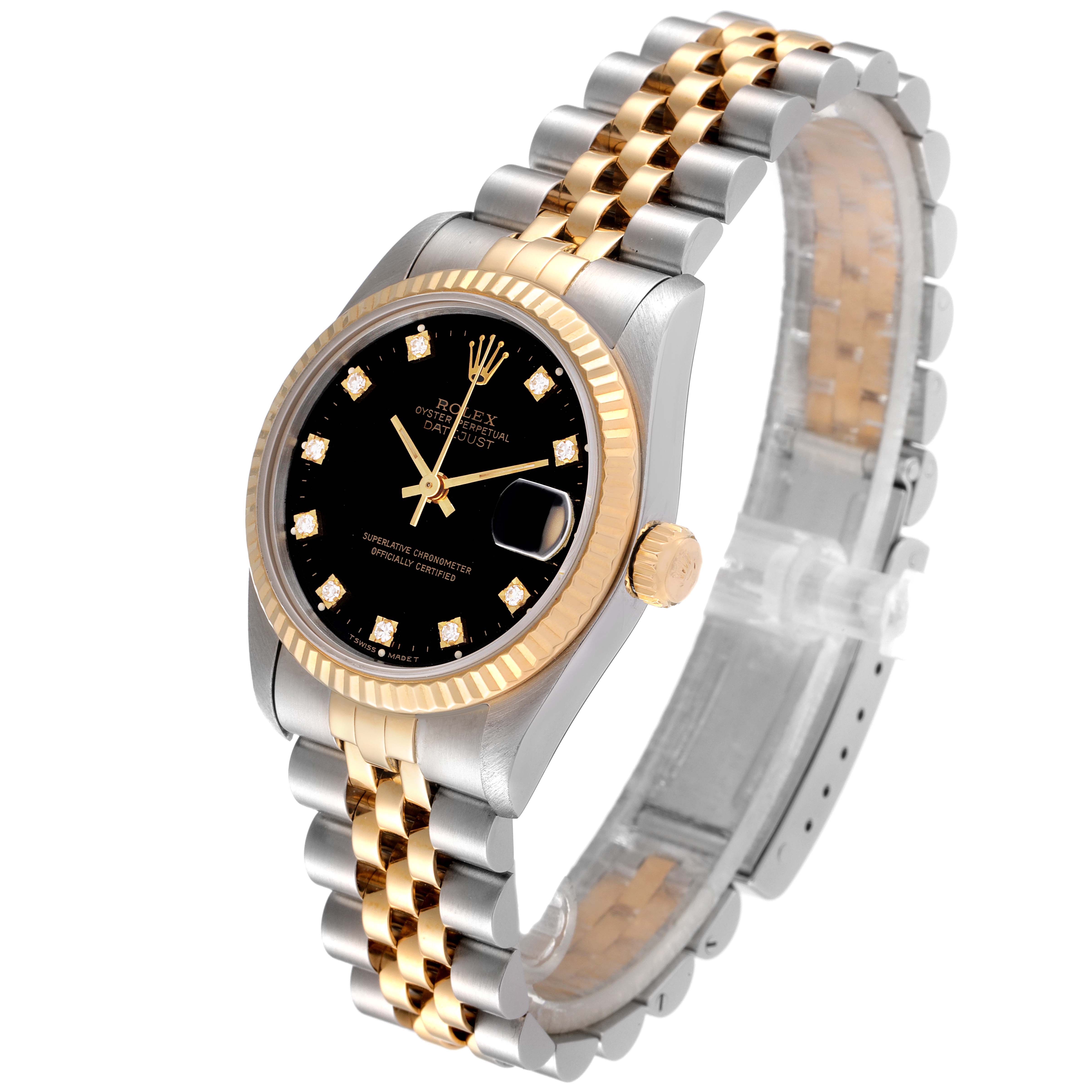 The image displays a Rolex Mid-Size 68273 Women
s Steel and Gold (two tone) Black Dial 68273 Women
s Steel and Gold (two tone) Black Dial Datejust watch at an angle showing its face, two-tone band, and crown.