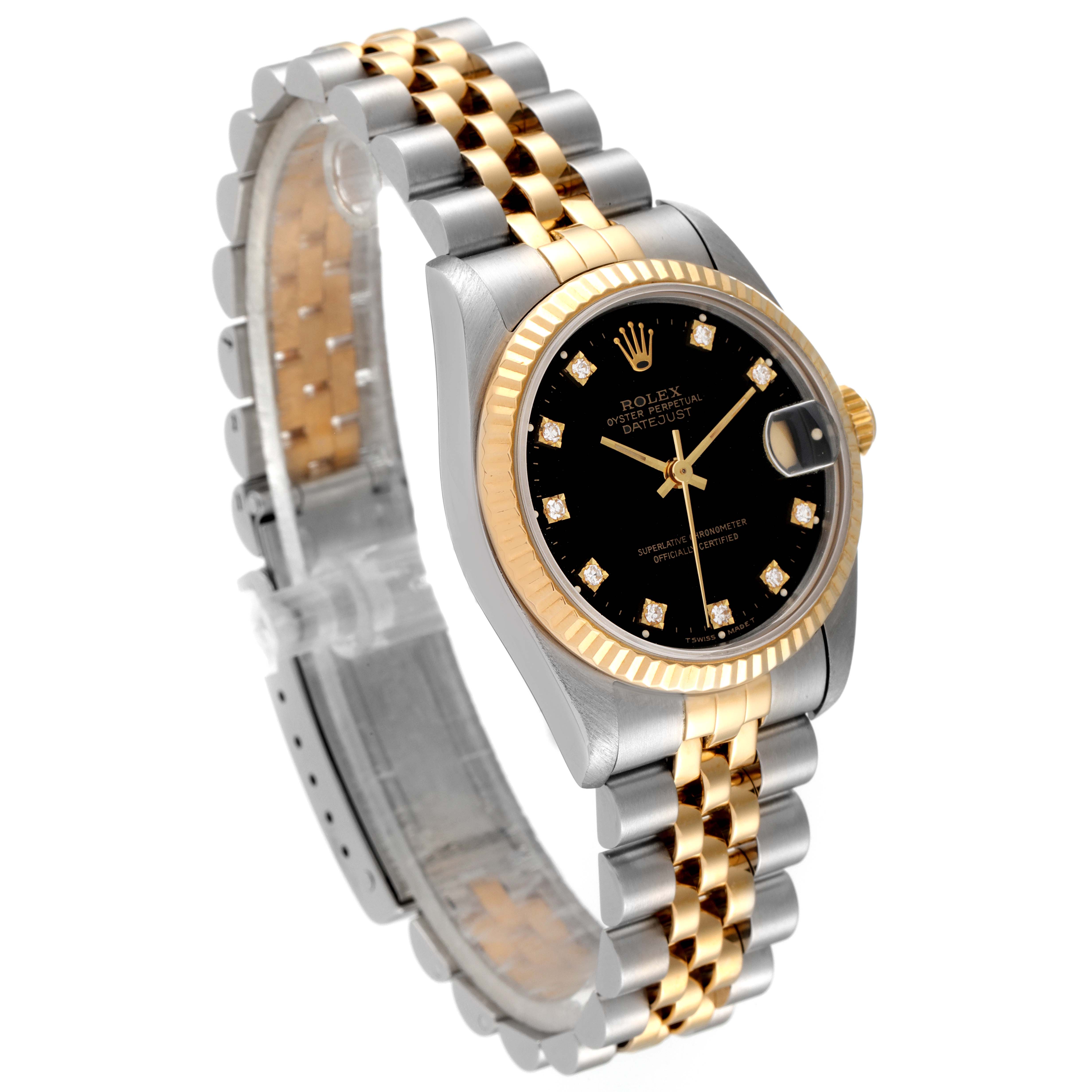 This image shows a side-angle view of the Mid-Size Rolex watch, highlighting its black dial, gold bezel, and two-tone bracelet.