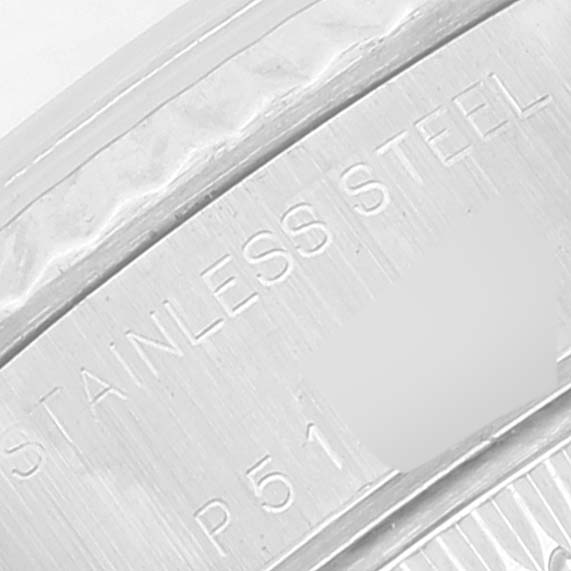 This image shows a close-up of the engraving on the stainless steel case or bezel of a Rolex Datejust 79174 Women's Stainless Steel Black Dial 79174 Women's Stainless Steel Black Dial watch.