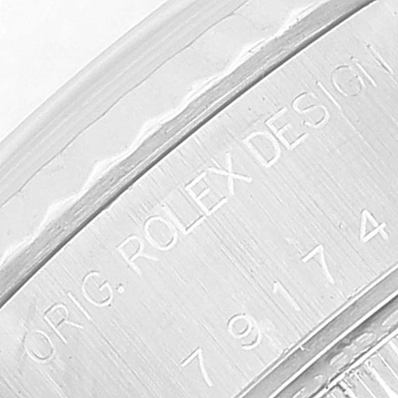 This close-up image shows part of the case back engraving on a Rolex Datejust 79174 Women's Stainless Steel Black Dial 79174 Women's Stainless Steel Black Dial watch.