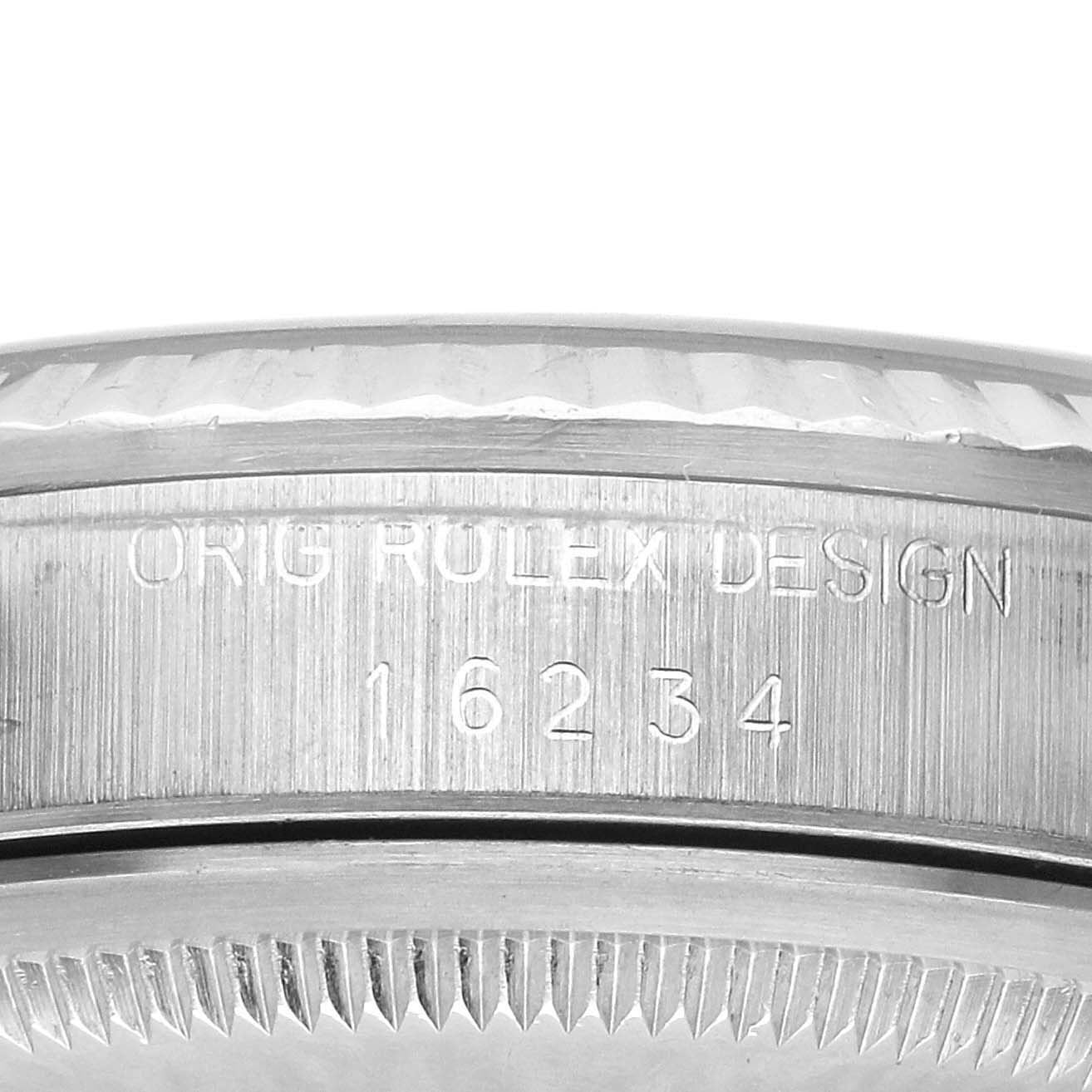 This image shows a close-up of the side of a Rolex Datejust 16234 Men's Stainless Steel Blue Dial 16234 Men's Stainless Steel Blue Dial, displaying the model number and part of the bezel.