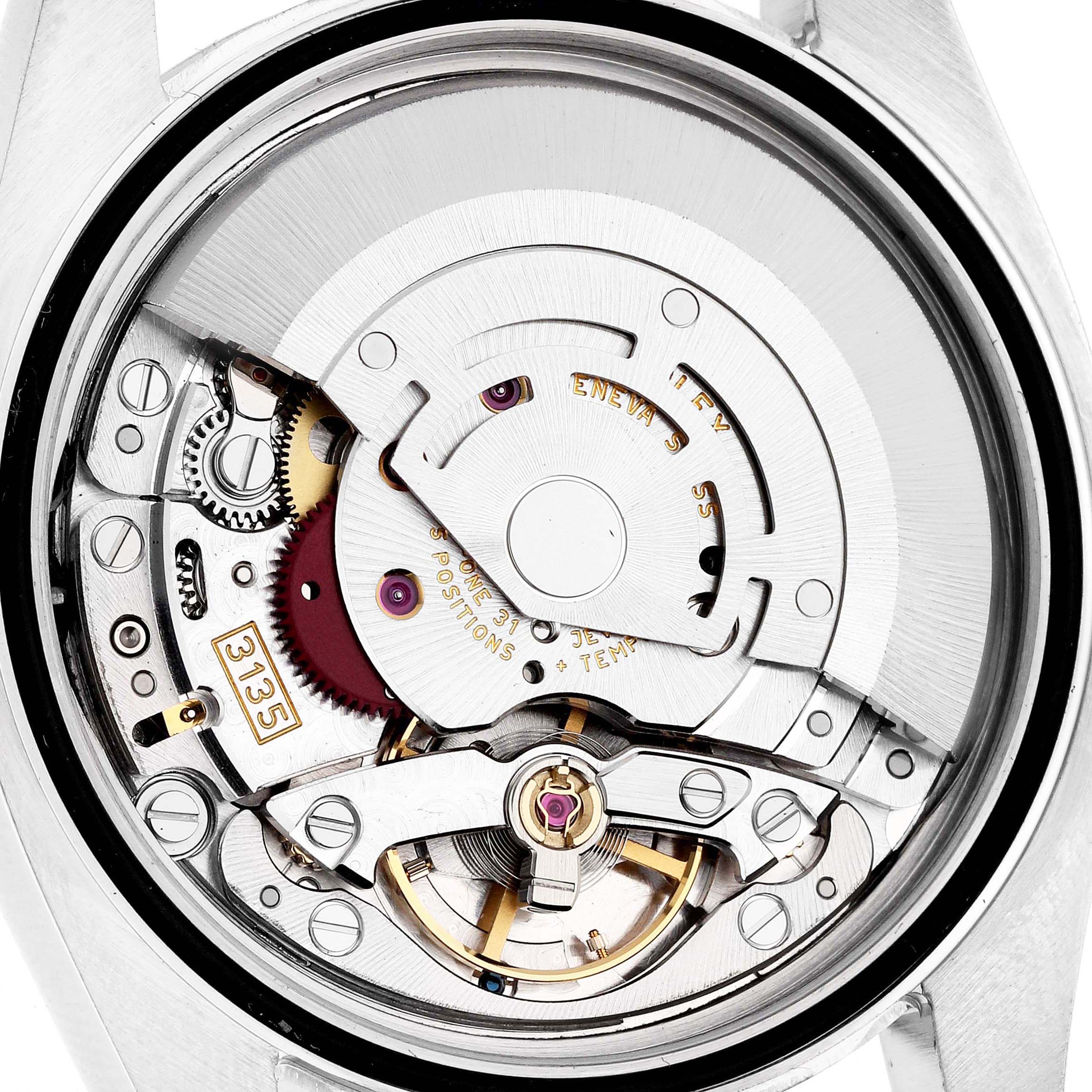 The image shows the movement and internal mechanics of a Rolex Datejust 116234 Men's Stainless Steel White Dial 116234 Men's Stainless Steel White Dial watch from a back angle.
