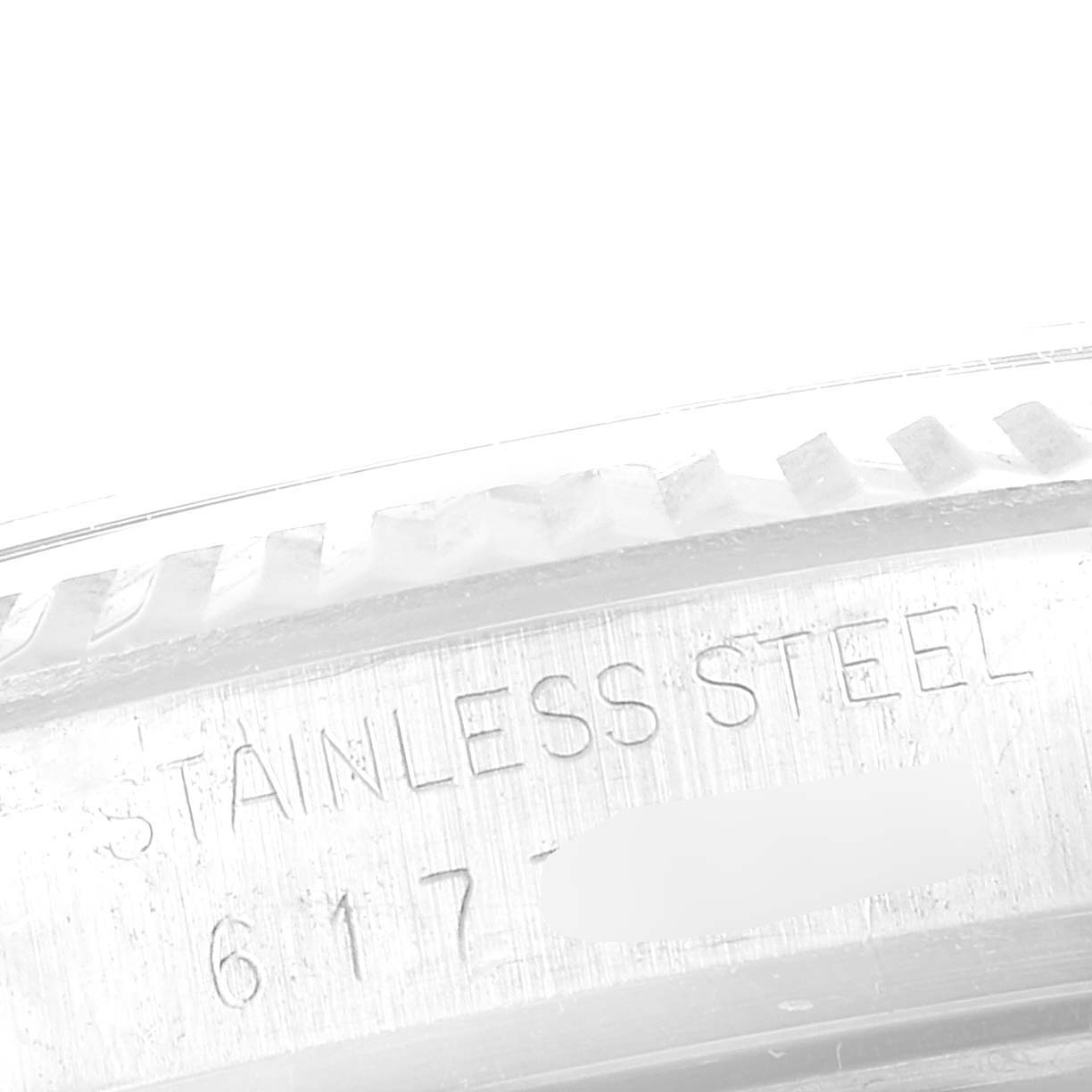 This image shows a close-up of the side, specifically the stainless steel casing, of a Vintage Collection model by Rolex.