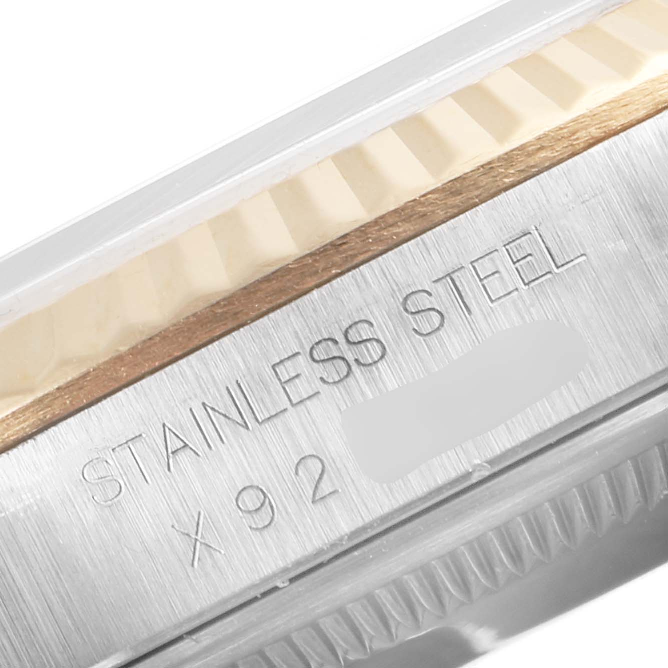 The image shows a close-up side view of the stainless steel case and fluted bezel of a Rolex Datejust 16233 Men's Steel and Gold (two tone) White Dial 16233 Men's Steel and Gold (two tone) White Dial watch.