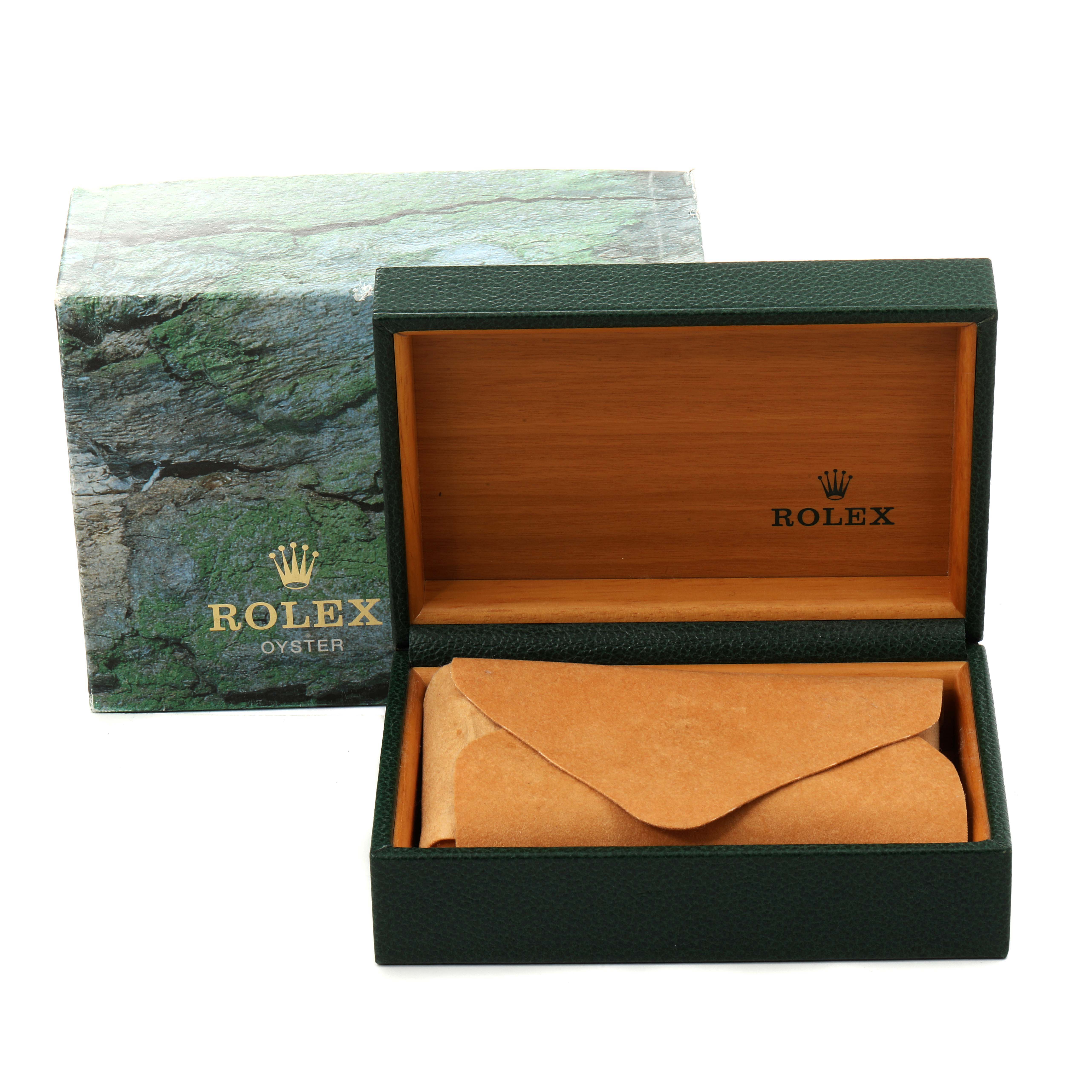 The image shows an open Rolex box with a green exterior and wood interior, along with a protective pouch for a Datejust model.