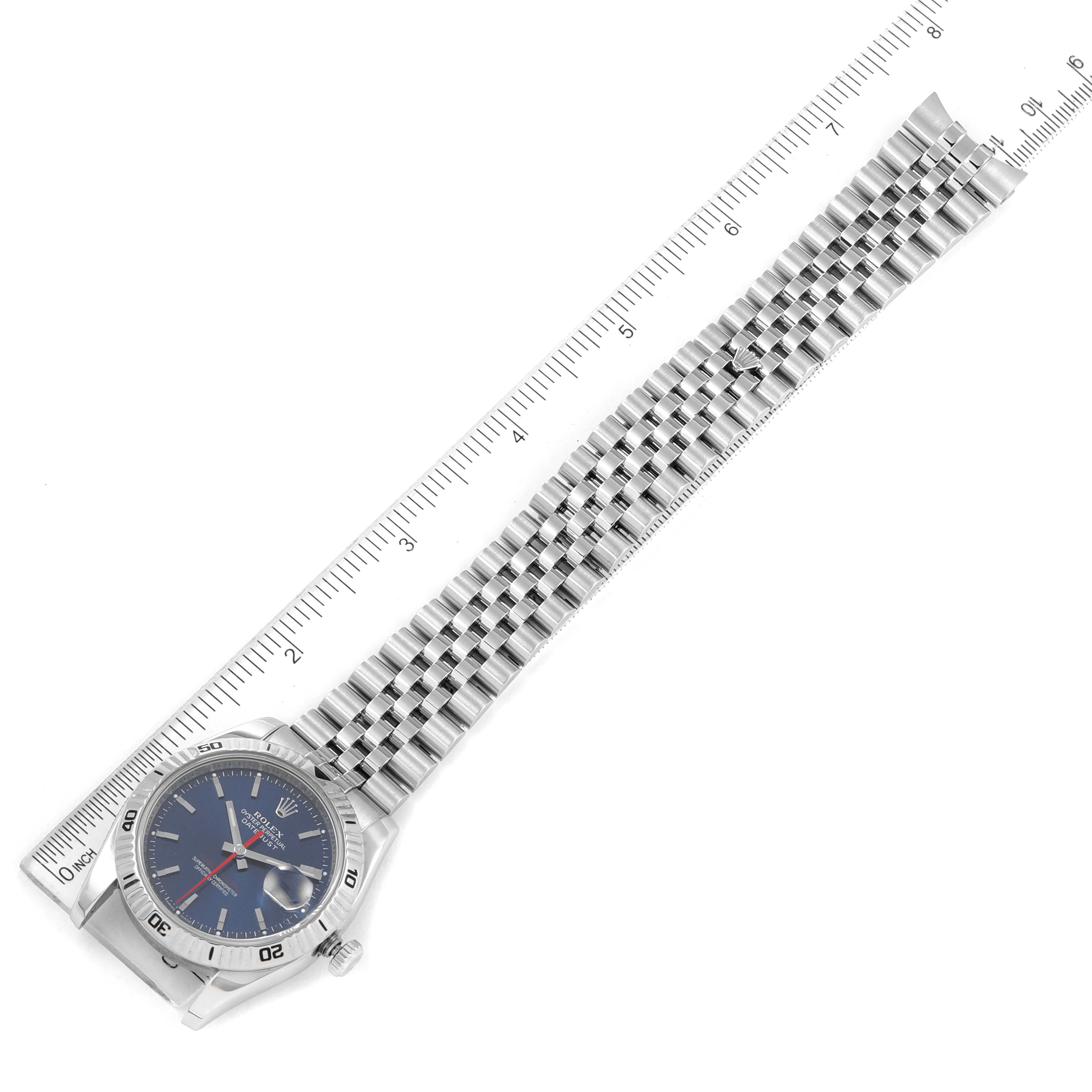 The Rolex Turn-o-Graph 116264 Men
s Stainless Steel Blue Dial 116264 Men
s Stainless Steel Blue Dial watch is shown flat with the face and full bracelet visible, placed alongside a ruler for measurement.