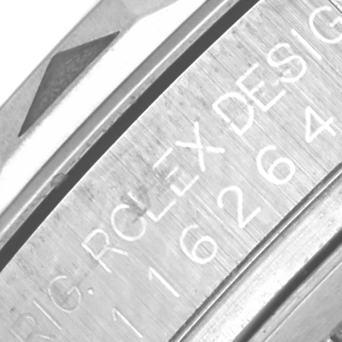 The image shows a close-up of the bezel and engraved serial number on a Rolex Turn-o-Graph 116264 Men's Stainless Steel Blue Dial 116264 Men's Stainless Steel Blue Dial watch.