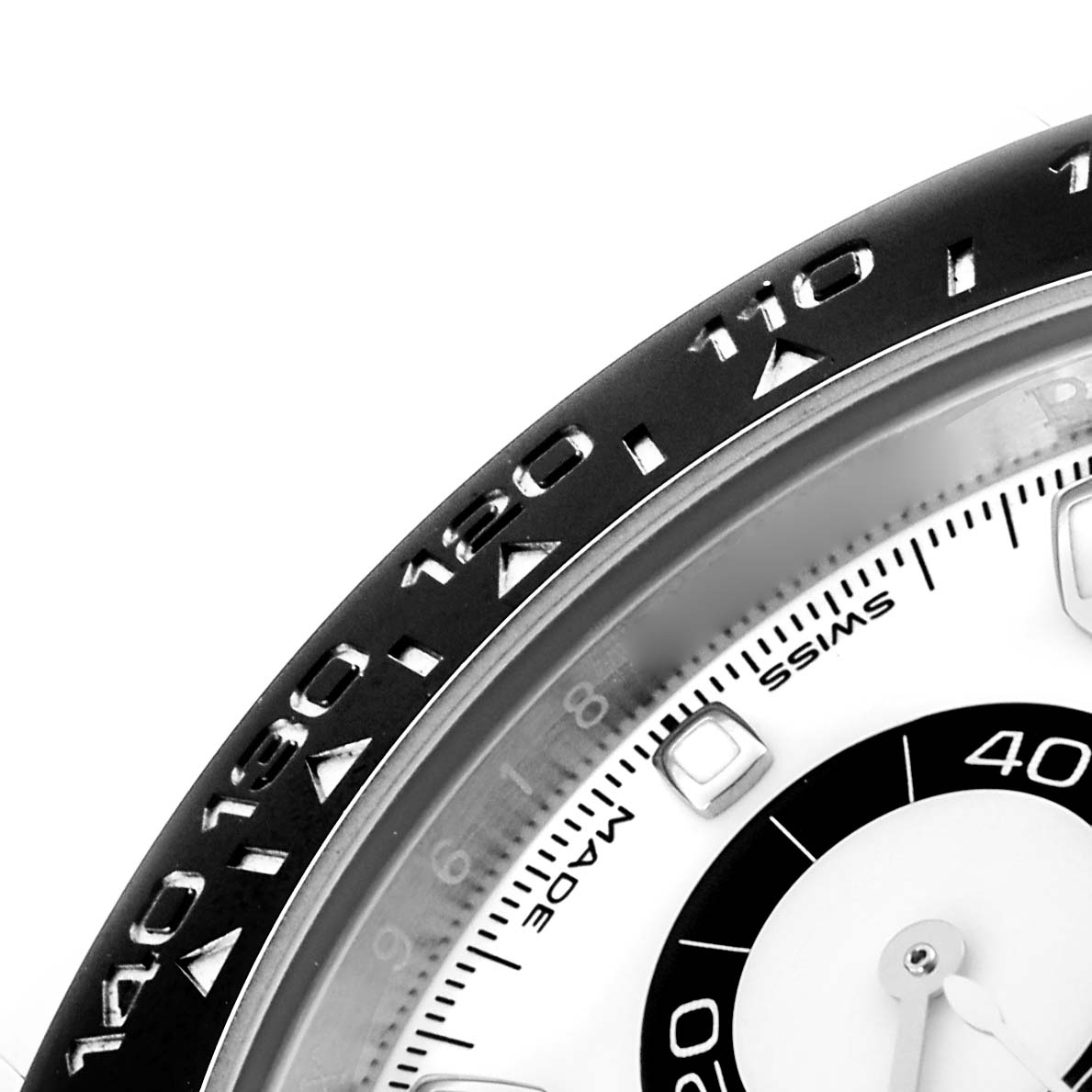The image shows a close-up of the bezel and part of the dial of the Rolex Daytona 116500LN Men's Stainless Steel White Dial 116500LN Men's Stainless Steel White Dial watch.