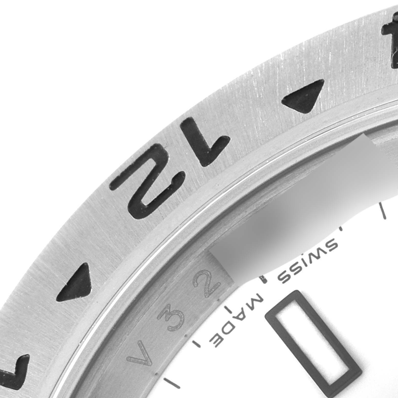 This image shows a close-up of the bezel, part of the dial, and the "Swiss Made" label of a Rolex Explorer 16570 Men's Stainless Steel White Dial 16570 Men's Stainless Steel White Dial watch.