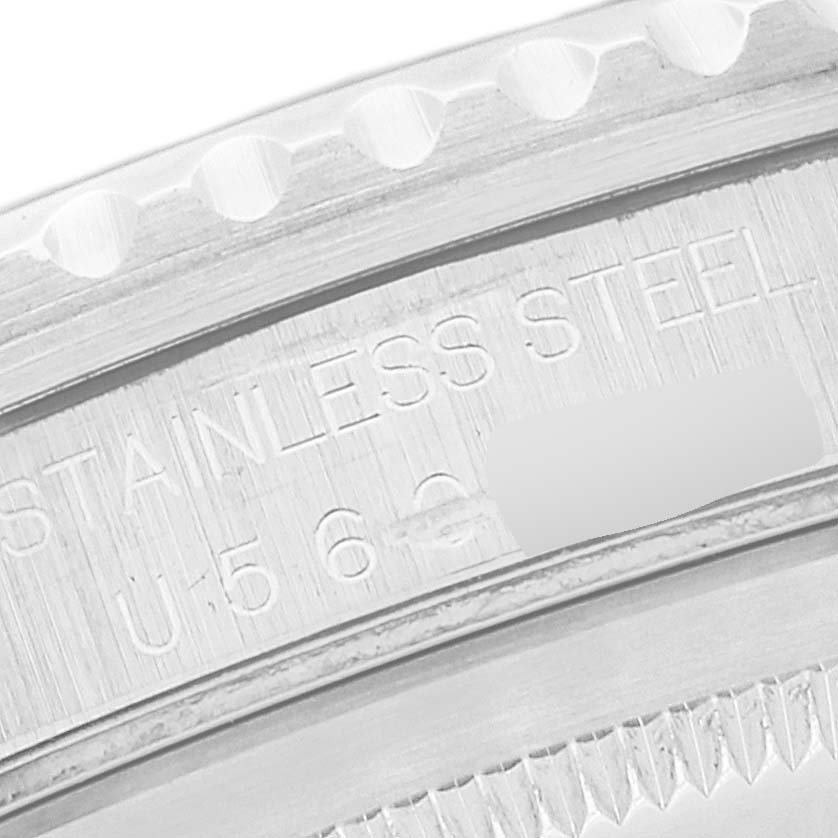 The image shows a close-up of the engraved stainless steel bezel of a Rolex GMT-Master 16700 Men's Stainless Steel Black Dial 16700 Men's Stainless Steel Black Dial watch.