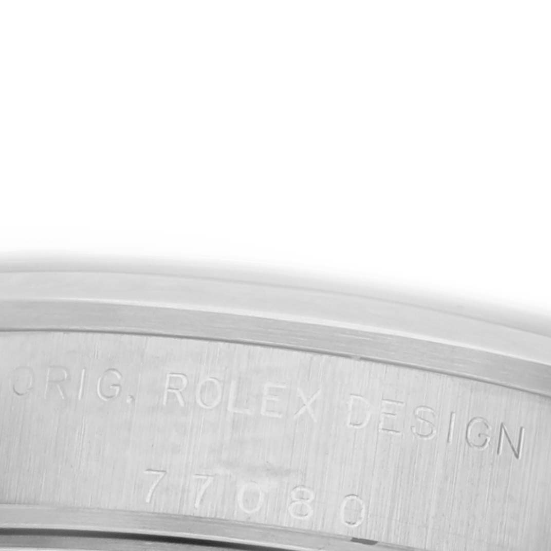 The image shows an engraved side view of the Rolex Mid-Size 77080 Women's Stainless Steel Blue Dial 77080 Women's Stainless Steel Blue Dial watch case with "ORIG. ROLEX DESIGN" and model number.