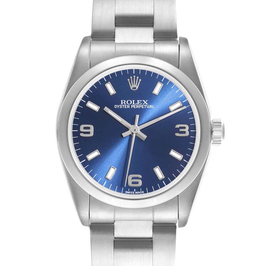 The Rolex Oyster Perpetual Mid-Size watch is shown from the front, displaying its blue dial, hour markers, hands, and crown.
