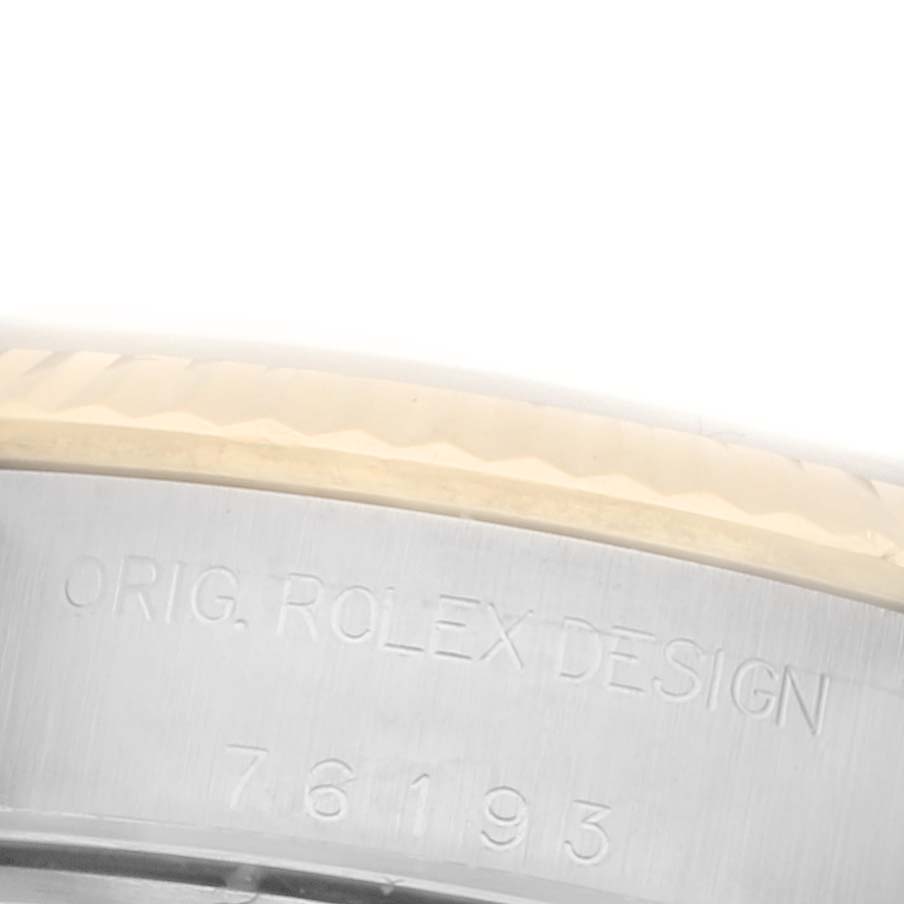 The image shows a close-up of the case back edge of a Rolex Oyster Perpetual 76193 Women's Steel and Gold (two tone) Champagne Dial 76193 Women's Steel and Gold (two tone) Champagne Dial, featuring engraved model details.