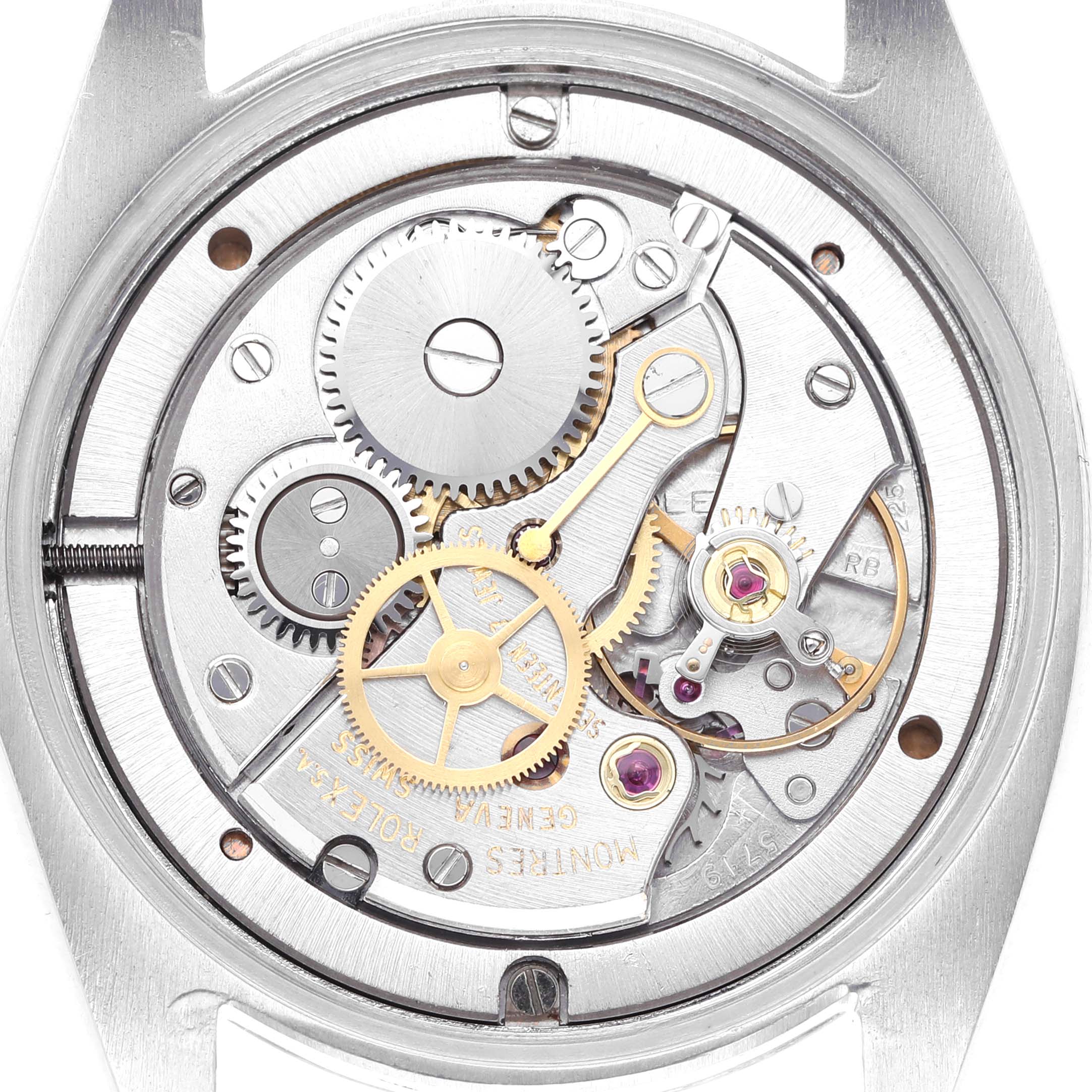 The image shows the movement mechanism of a Rolex Date 6694 Men's Stainless Steel Silver Dial 6694 Men's Stainless Steel Silver Dial model watch from a back angle, displaying gears and components.