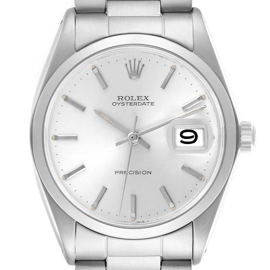 The image shows a Rolex Oysterdate watch from a front angle, highlighting the dial, hands, crown, and date window.