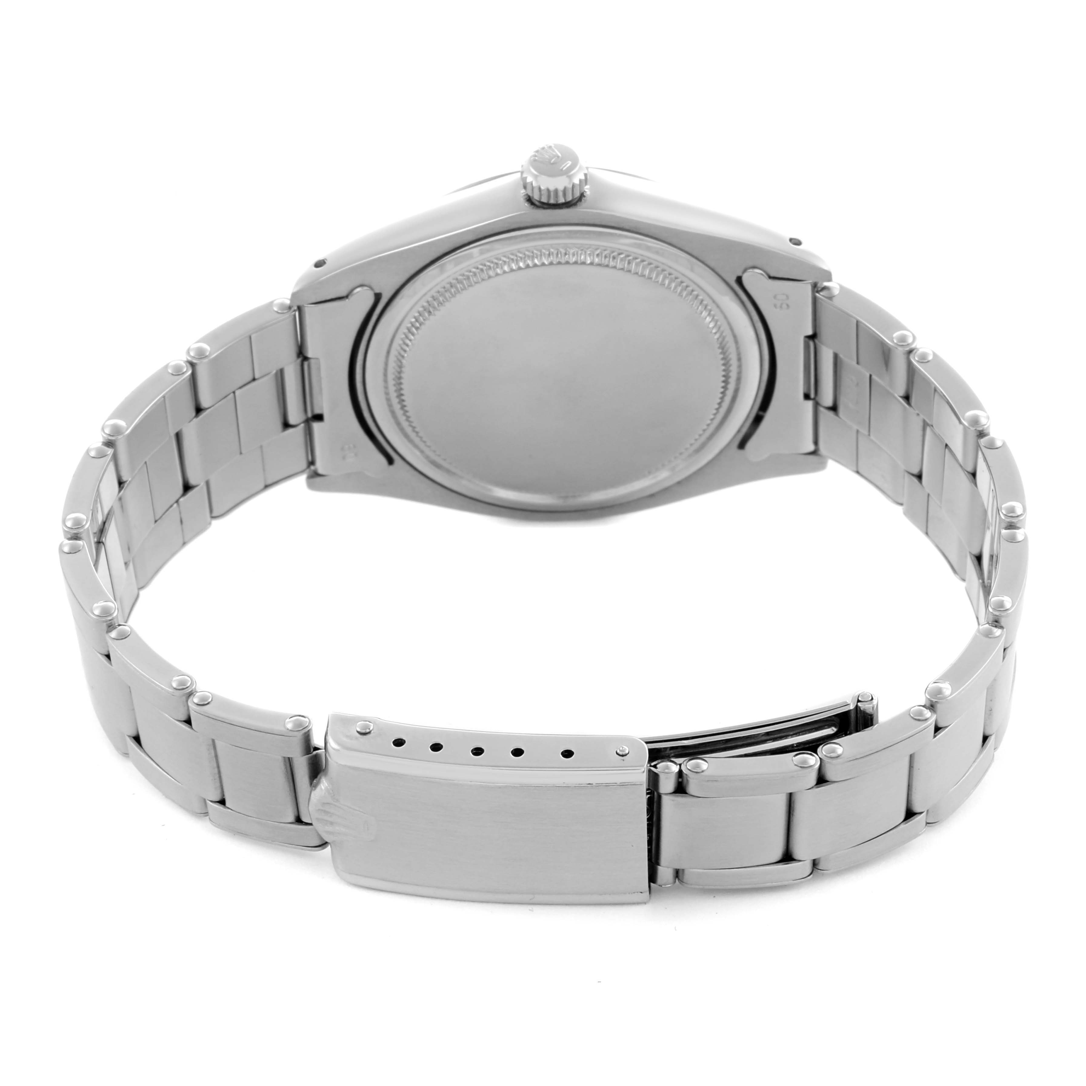 The Rolex Date 6694 Men's Stainless Steel Silver Dial 6694 Men's Stainless Steel Silver Dial watch is shown from the back, displaying its case back, bracelet, and clasp.