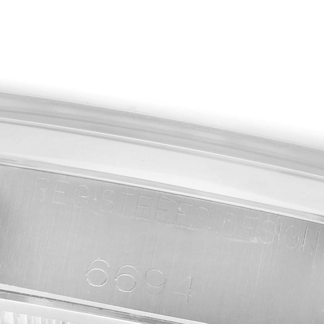 This image shows the inner case engraving with the model number "6694" of a Rolex Date 6694 Men's Stainless Steel Silver Dial 6694 Men's Stainless Steel Silver Dial watch.