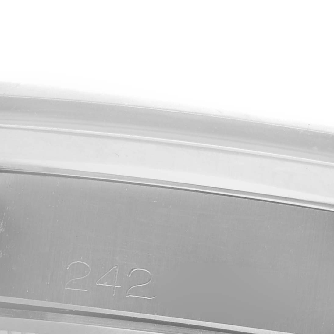 The image focuses on the inner bezel of a Rolex Date 6694 Men's Stainless Steel Silver Dial 6694 Men's Stainless Steel Silver Dial model watch, showing a close-up of the engraved number "242."