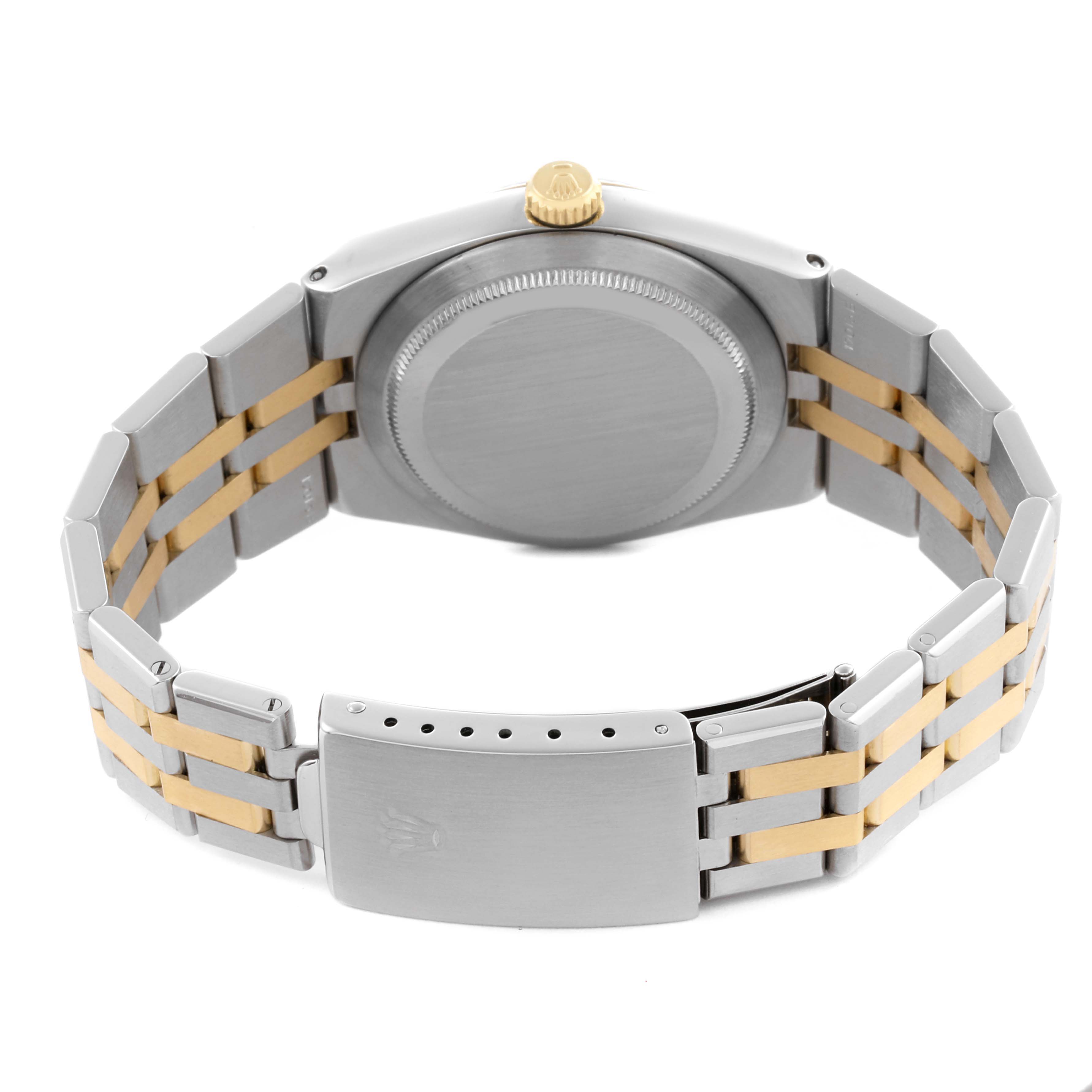 The Rolex Oysterquartz 17013 Men's Steel and Gold (two tone) Champagne Dial 17013 Men's Steel and Gold (two tone) Champagne Dial watch is shown from the back, highlighting the bracelet, clasp, and case back.