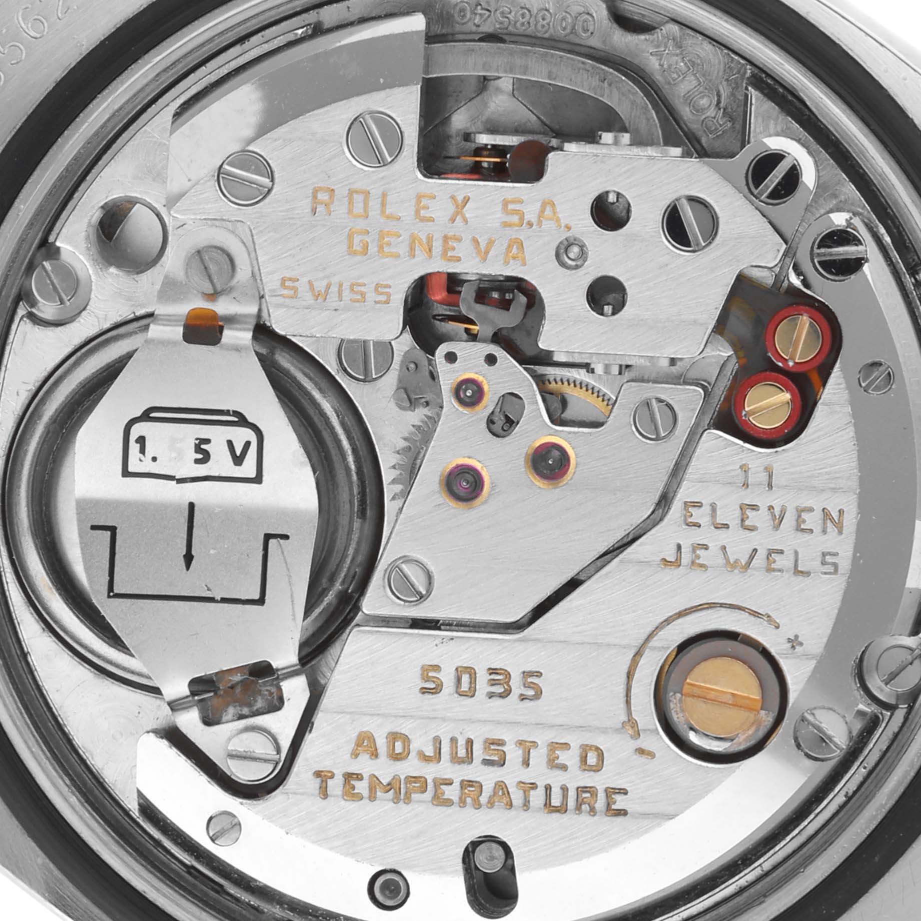 The image shows a close-up view of the Rolex Oysterquartz 17013 Men's Steel and Gold (two tone) Champagne Dial 17013 Men's Steel and Gold (two tone) Champagne Dial movement, displaying components like gears, jewels, and a battery compartment.