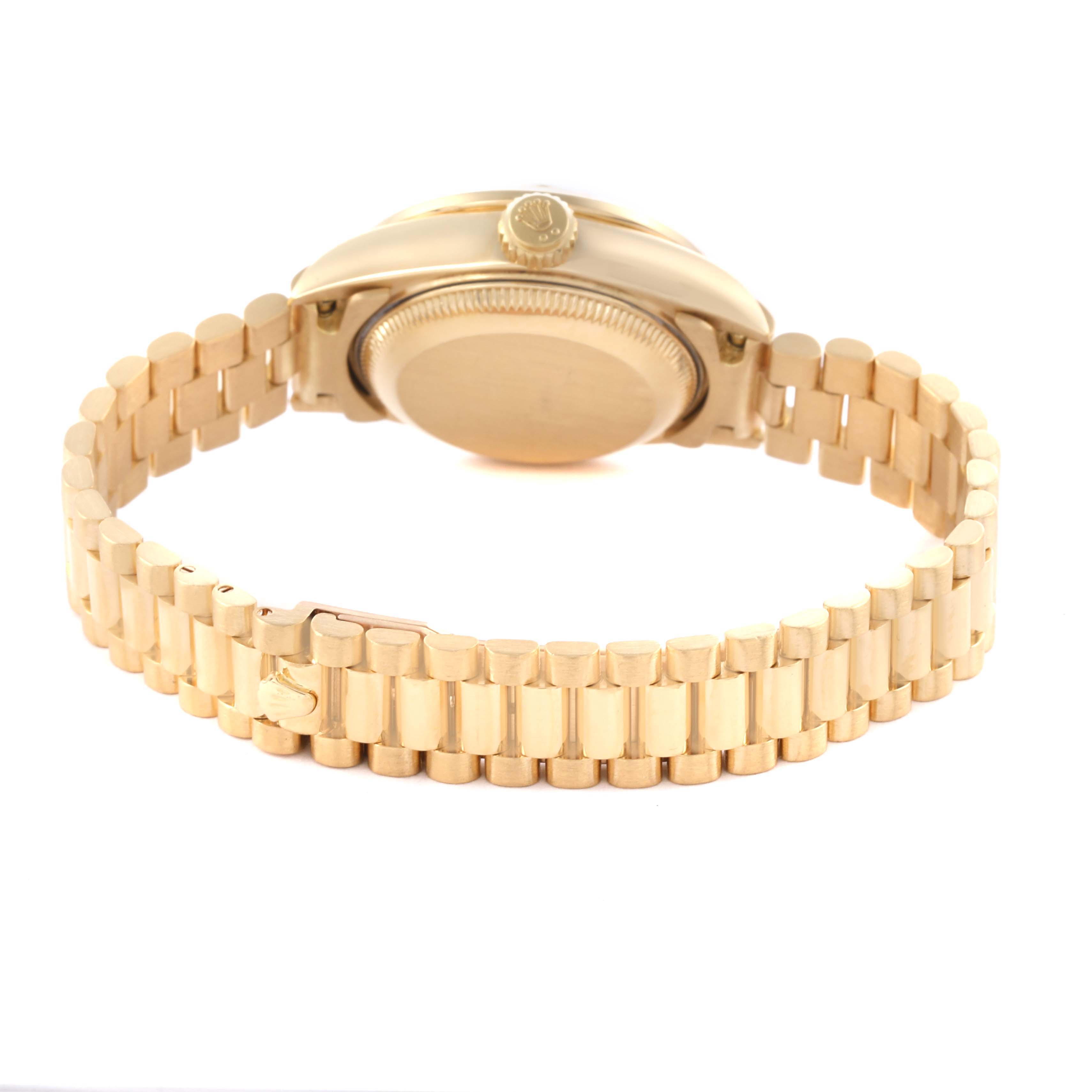 The Rolex President 79138 Women's Yellow Gold White Dial 79138 Women's Yellow Gold White Dial model is shown from the back, highlighting its case back, crown, and gold bracelet links.