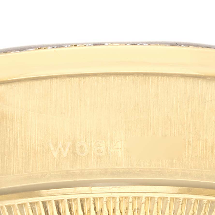 The image shows a close-up of the side profile of a Rolex President 79138 Women's Yellow Gold White Dial 79138 Women's Yellow Gold White Dial model watch, highlighting the bezel and part of the case.