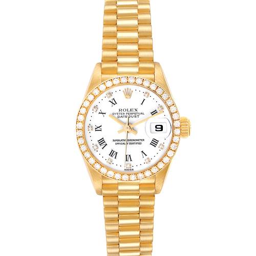 The Rolex President model watch is shown from a top-down angle, highlighting its gold bracelet, diamond-bezel, and white dial with Roman numerals.