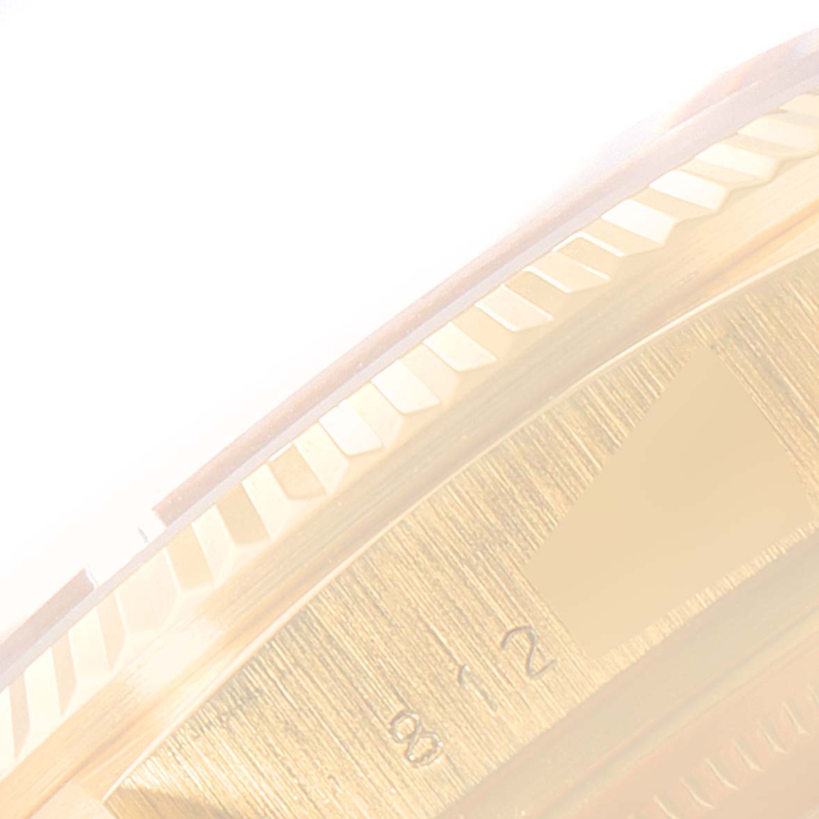 This image shows a close-up of the bezel and partial dial of the Rolex President 18038 Men
s Yellow Gold Champagne Dial 18038 Men
s Yellow Gold Champagne Dial model watch.