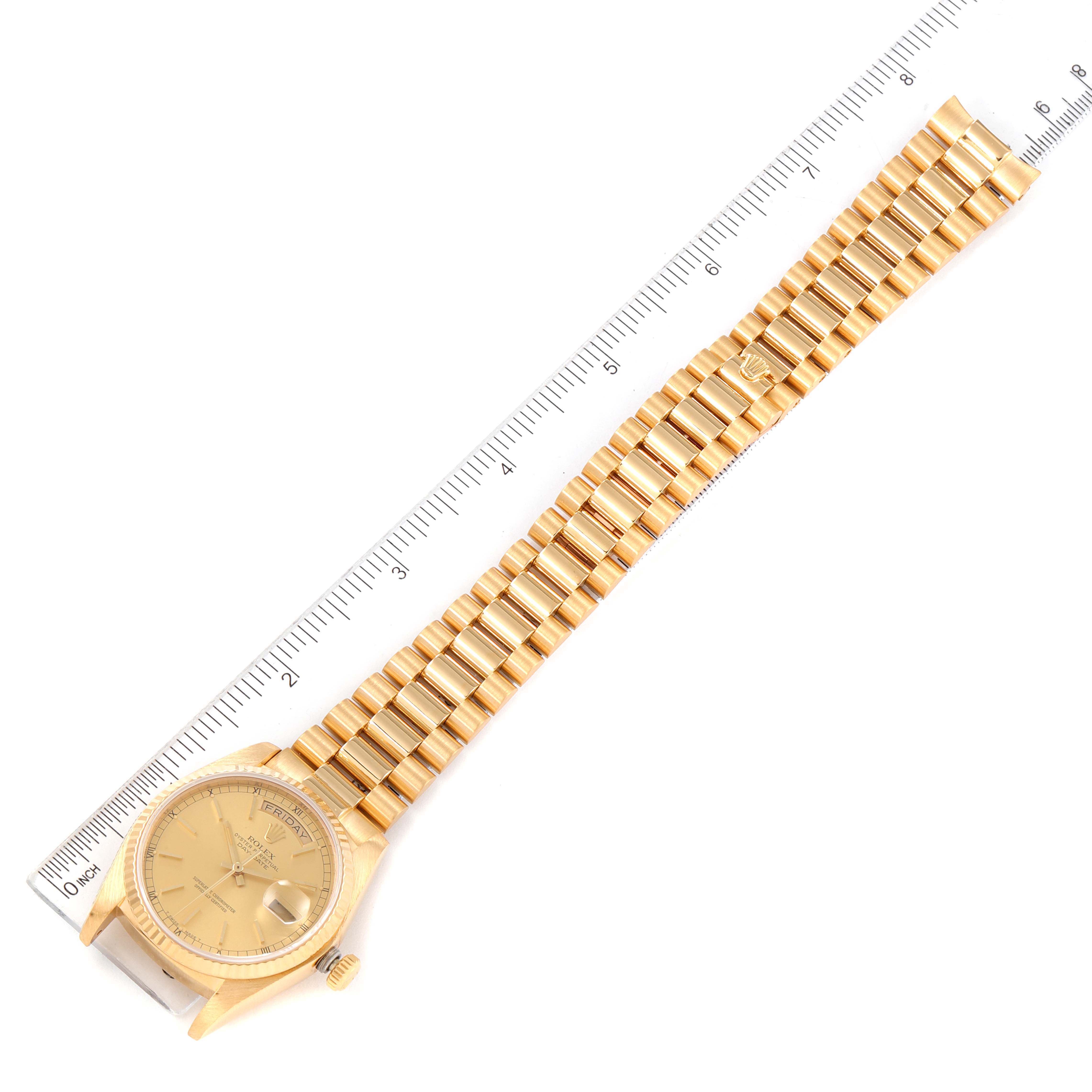The image shows a Rolex President 18038 Men
s Yellow Gold Champagne Dial 18038 Men
s Yellow Gold Champagne Dial model watch laid flat with a ruler for scale.