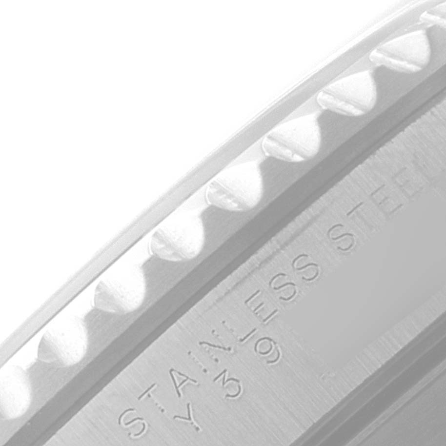 This image shows a close-up of the stainless steel bezel edge and part of the casing of a Rolex Submariner 14060 Men
s Stainless Steel Black Dial 14060 Men
s Stainless Steel Black Dial watch.