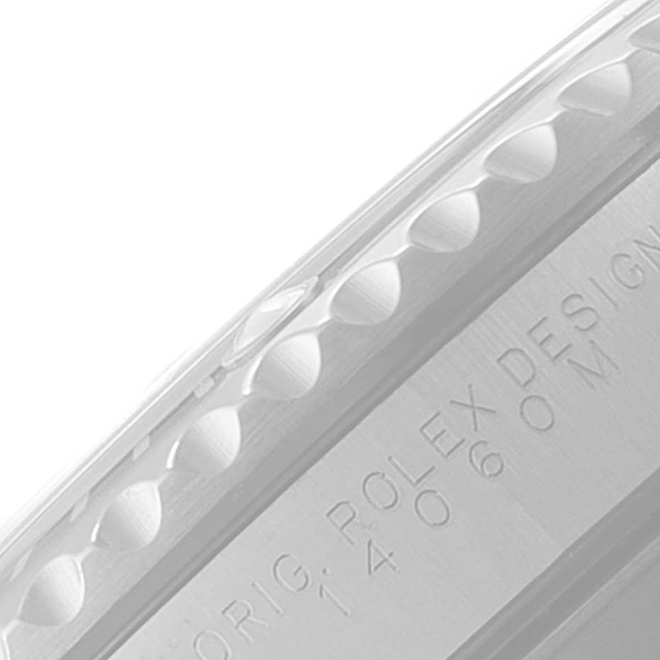 This image shows a close-up of the side engraving and knurled bezel edge of a Rolex Submariner 14060 Men
s Stainless Steel Black Dial 14060 Men
s Stainless Steel Black Dial watch.