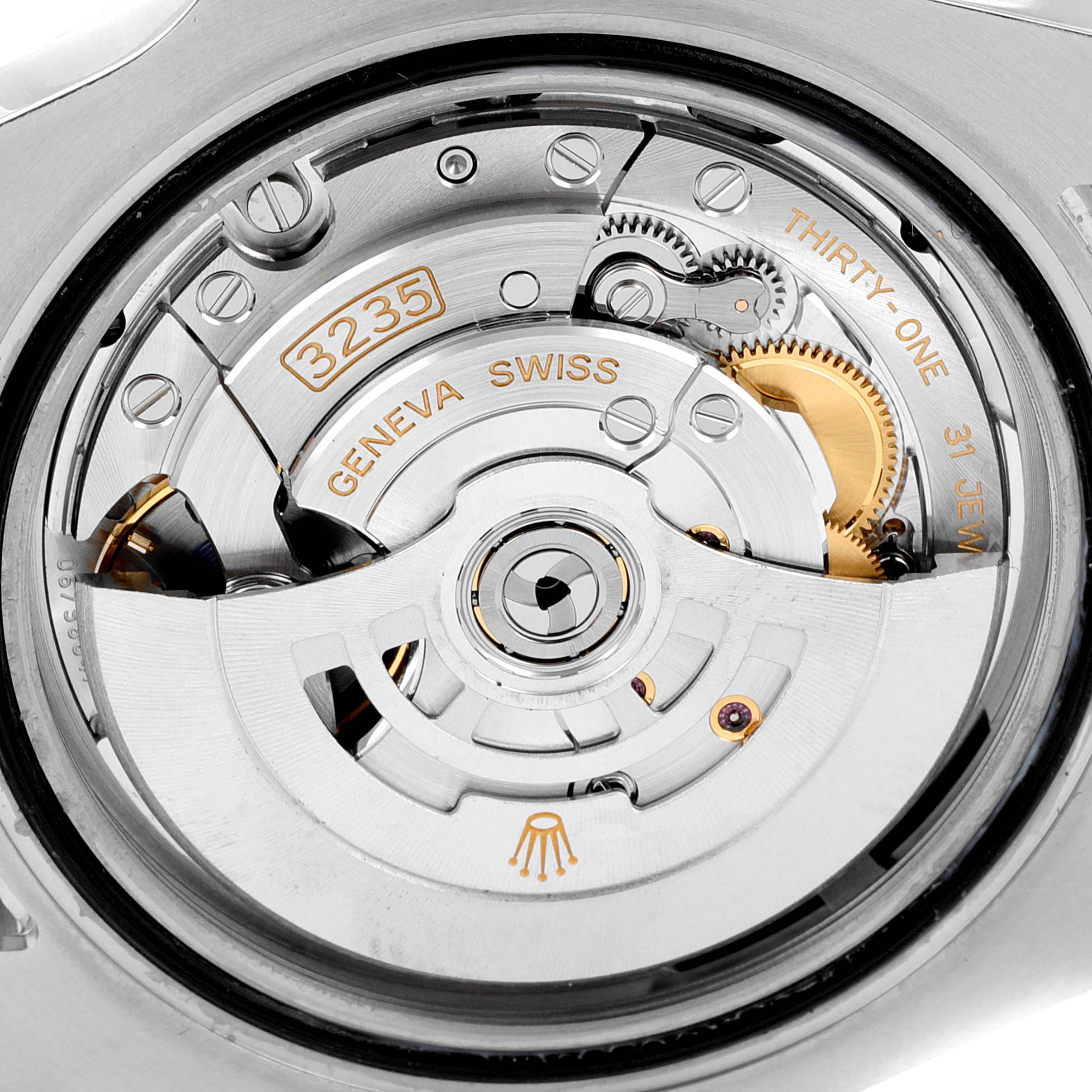 This image shows the movement of a Rolex Submariner 126610 Men's Stainless Steel Black Dial 126610 Men's Stainless Steel Black Dial model, highlighting intricate gears and engravings from a close-up angle.