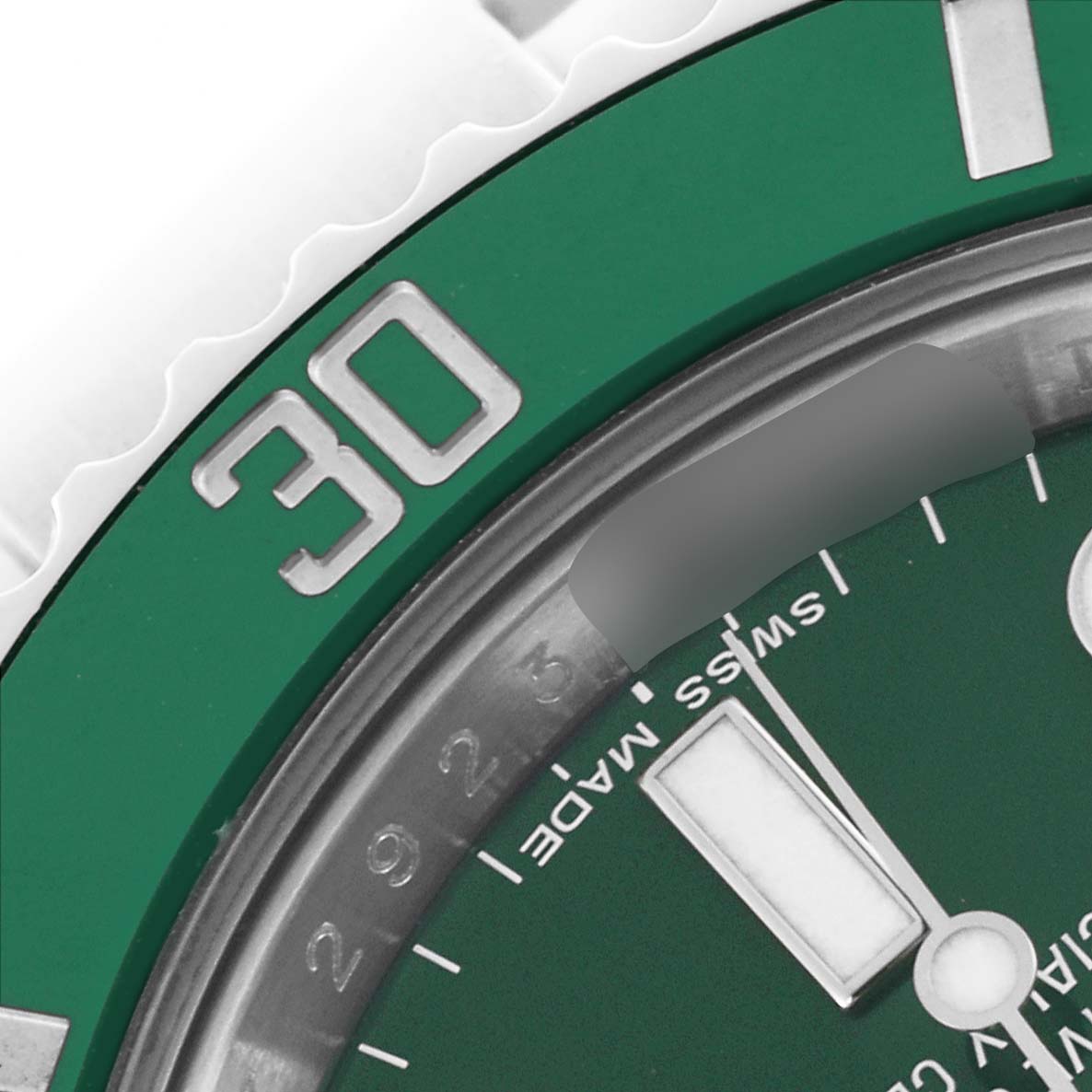 The image shows a close-up of the green bezel and part of the dial of a Rolex Submariner 116610LV Men's Stainless Steel Green Dial 116610LV Men's Stainless Steel Green Dial, highlighting the "30" minute marker.
