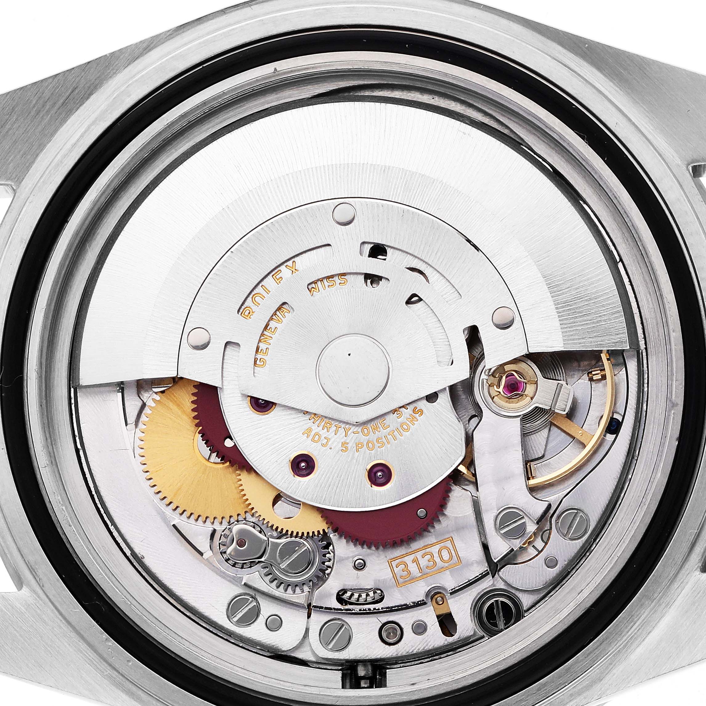 The image shows the movement of a Rolex Submariner 14060M Men's Stainless Steel Black Dial 14060M Men's Stainless Steel Black Dial watch from a top-down angle, highlighting its intricate internal components.