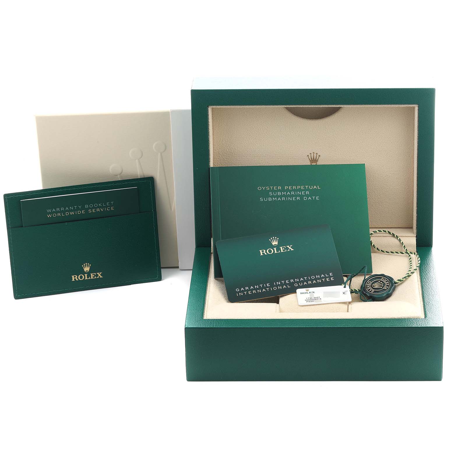 The image shows the packaging and accessories for a Rolex Submariner 124060 Men's Stainless Steel Black Dial 124060 Men's Stainless Steel Black Dial, including booklets, a cardholder, and a tag.