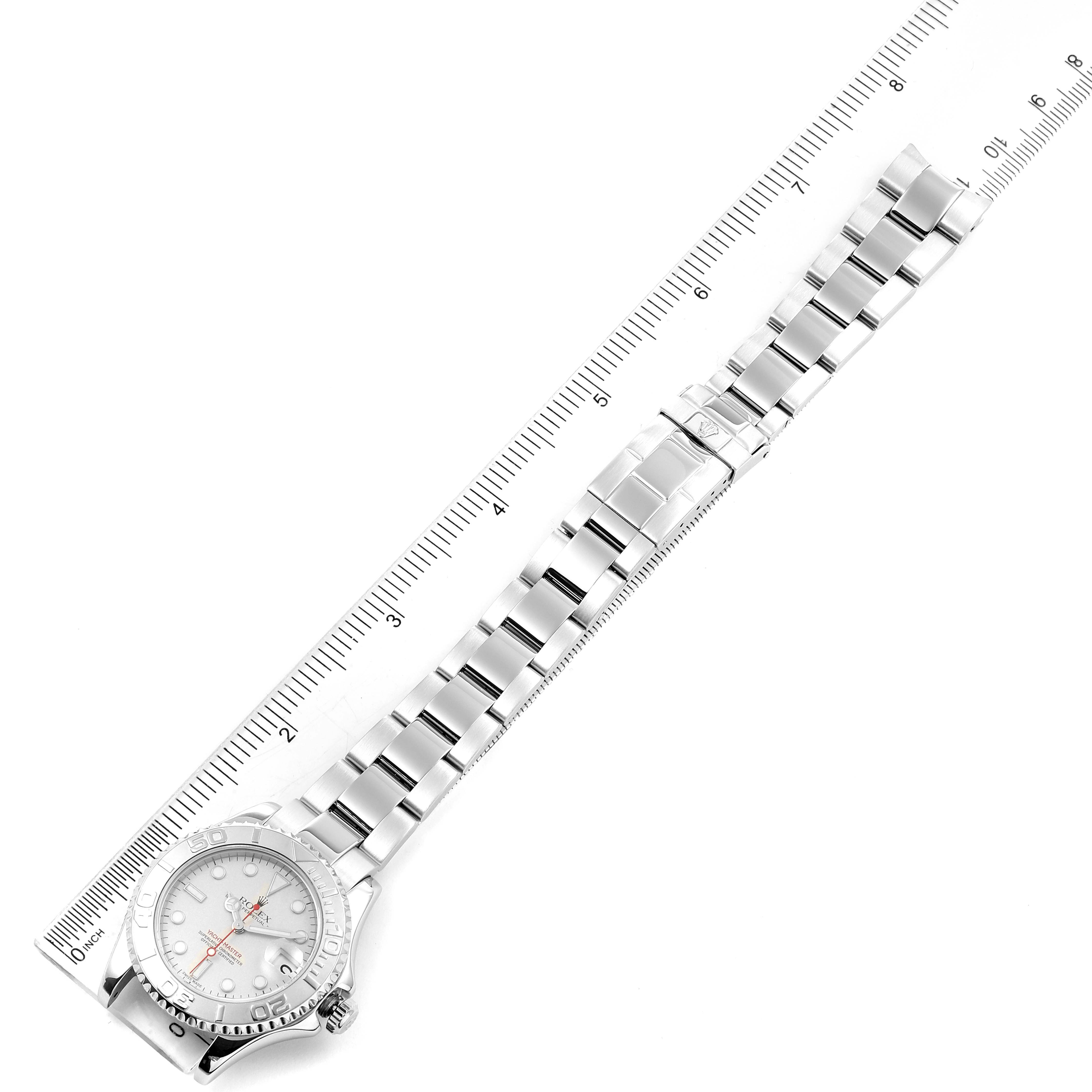The image shows an overhead view of a Rolex Yacht-Master 168622 Men's Stainless Steel Silver Dial 168622 Men's Stainless Steel Silver Dial watch laid flat next to a ruler.